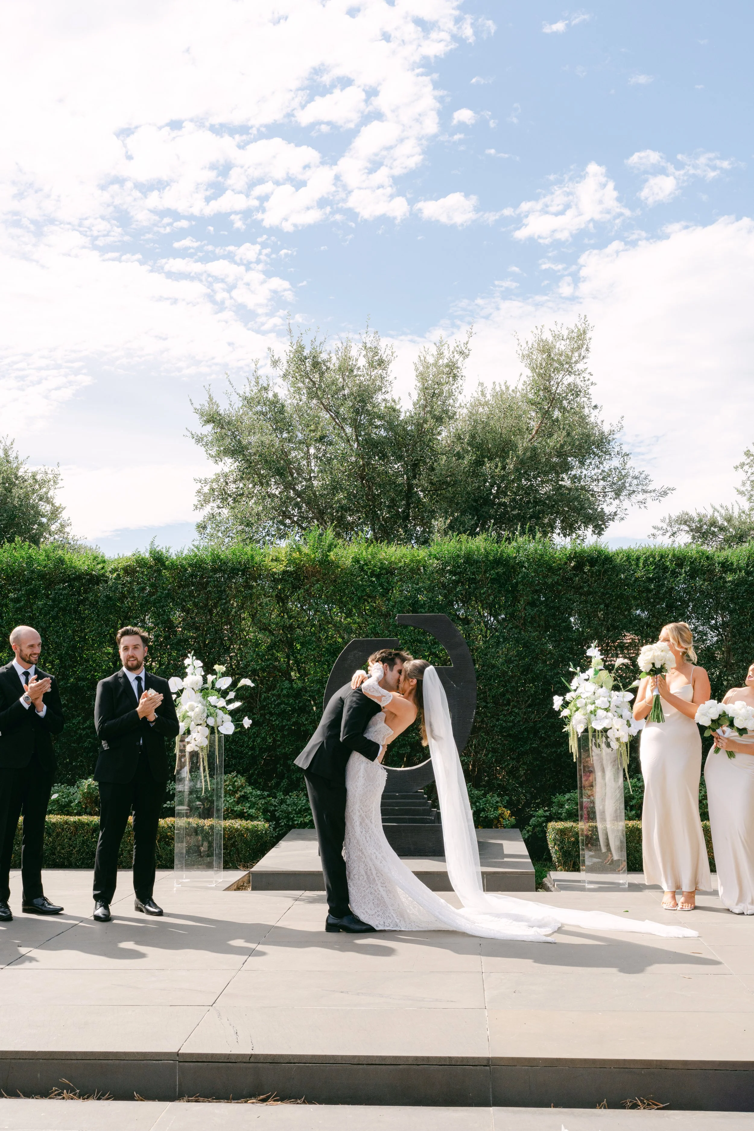 Marriage Celebrant Olivia Ferraro at Meadowbank Estate where couple are kissing