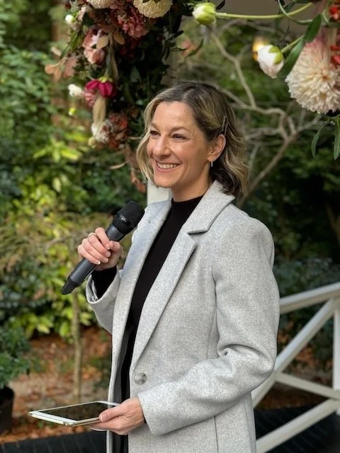 Woman holding microphone Marriage Celebrant Olivia Ferraro