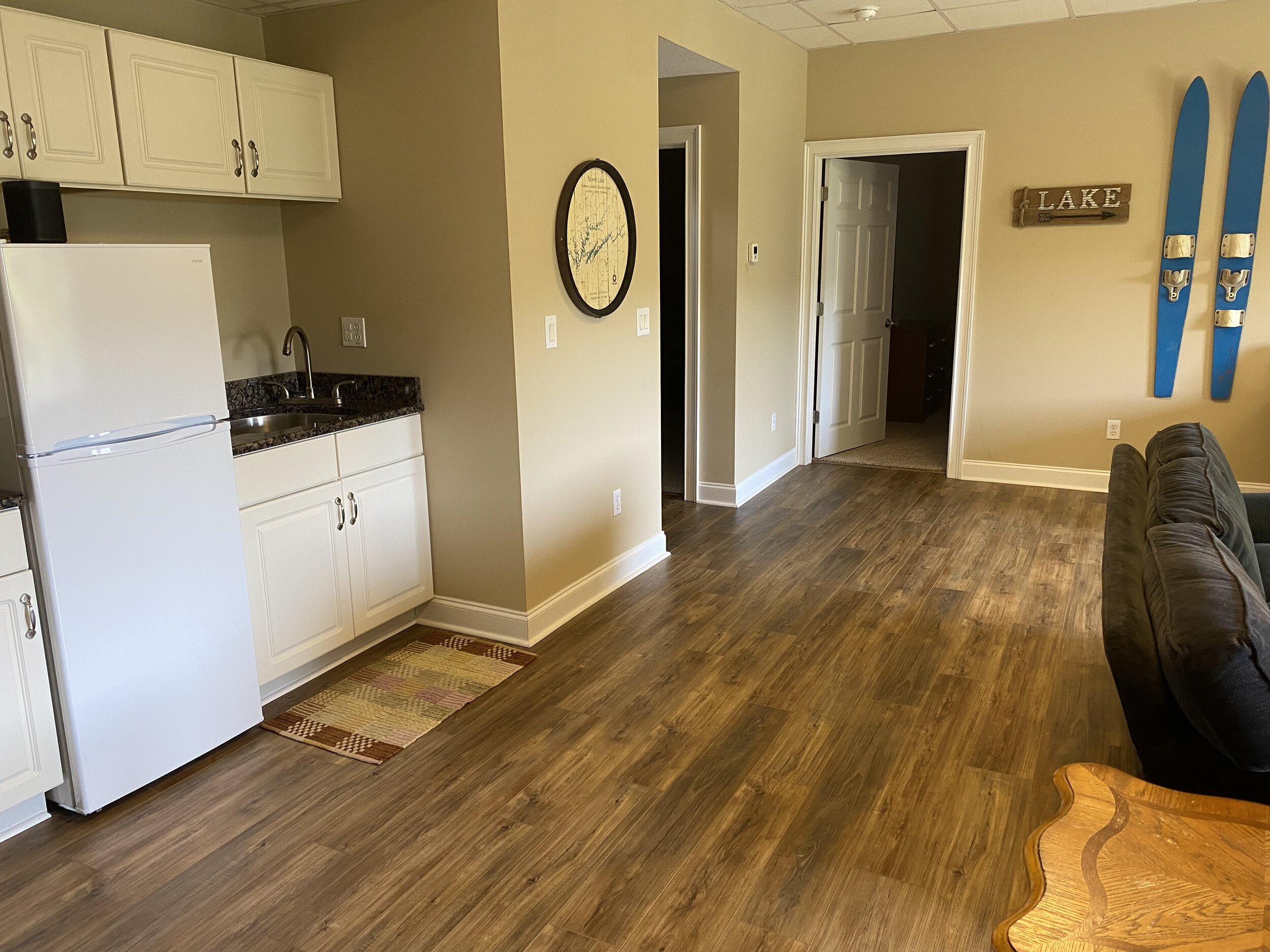 Lower level wet bar with extra refrigerator