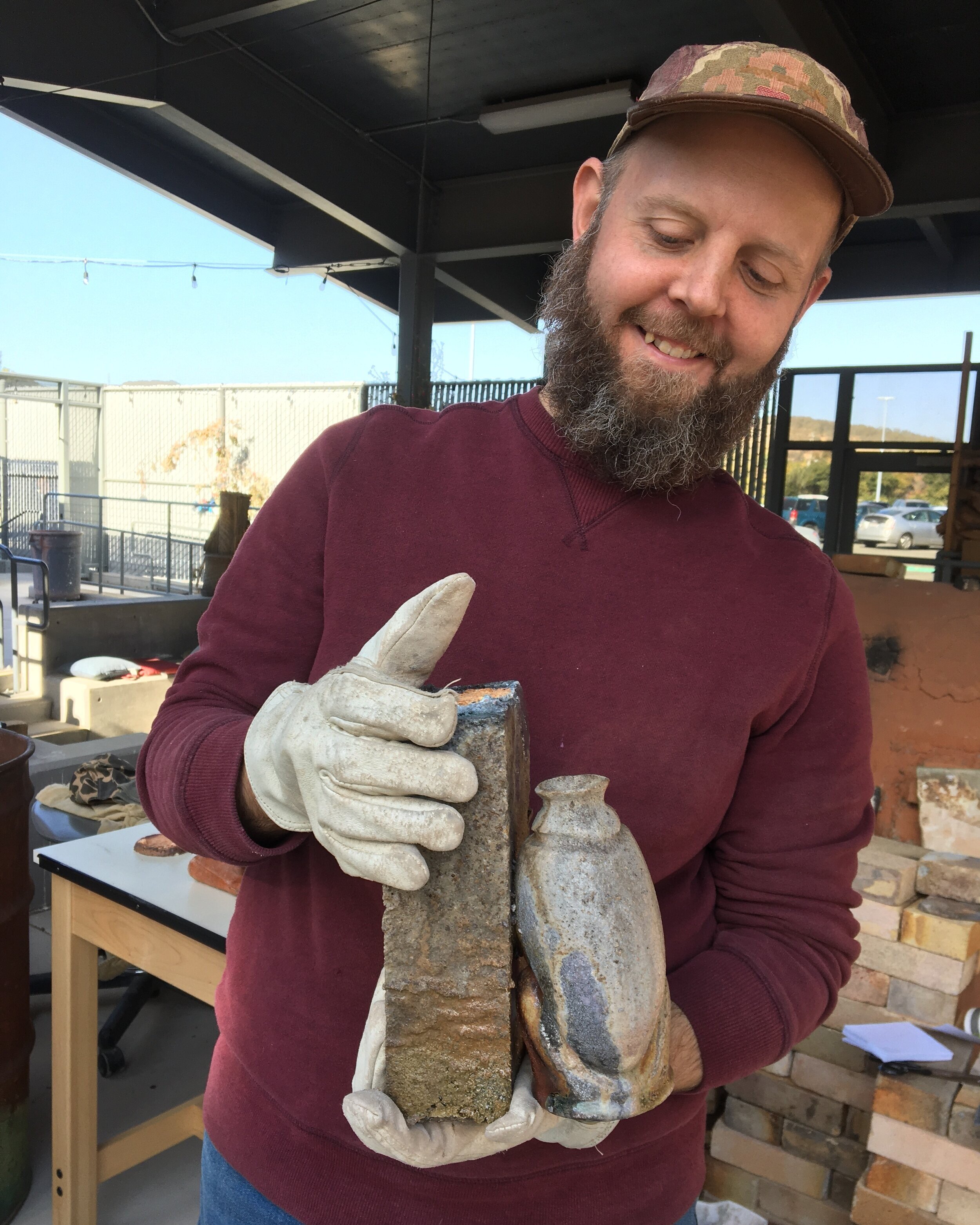 Holding a collaboration of my bottle with a shelf brick