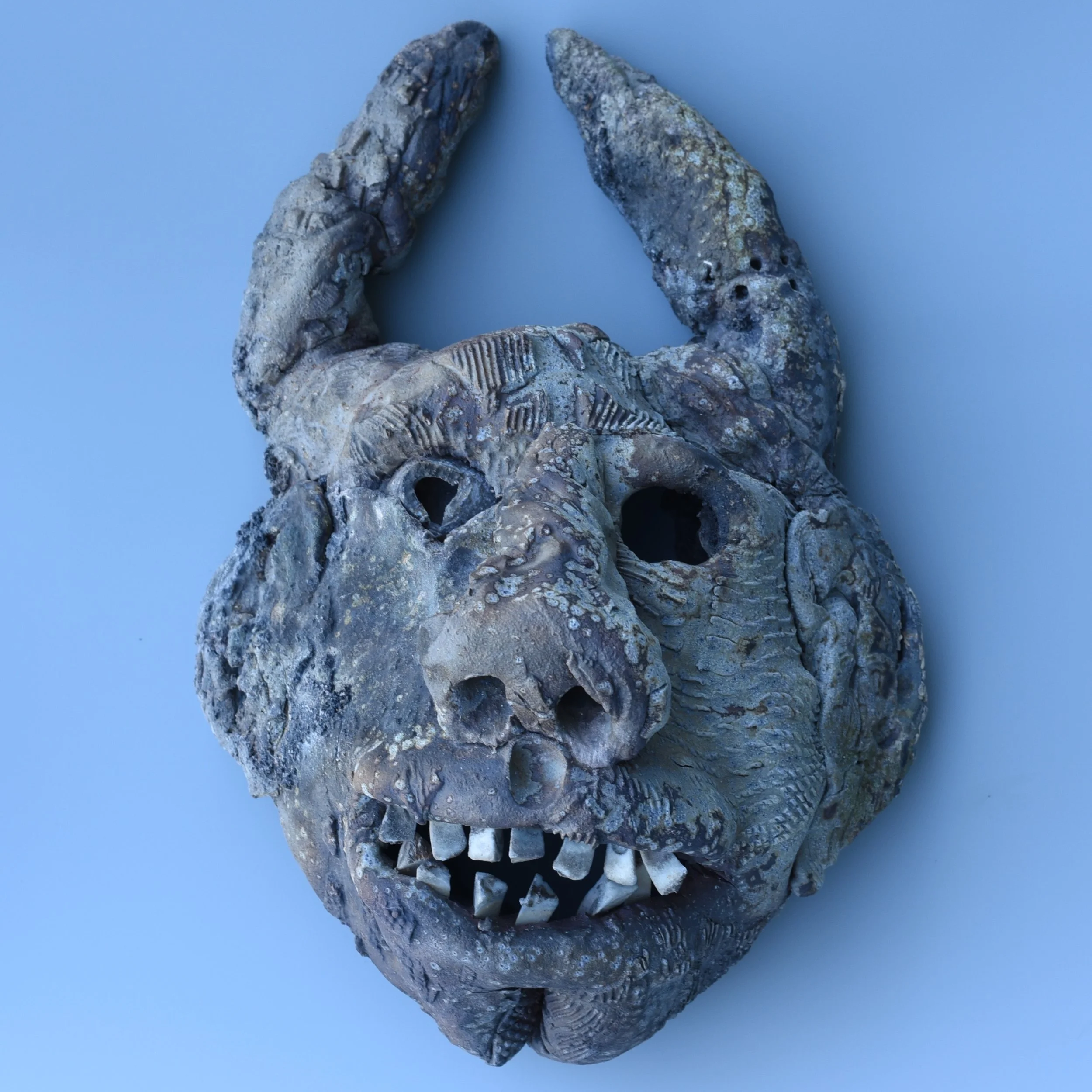 Great demon mask from the most recent anagama firing @cobbartandecology 

Built from textured slabs and packed with character. This guy was put through the literal fires of hell (but in a good, creative way!) in the kiln and came out looking like a c