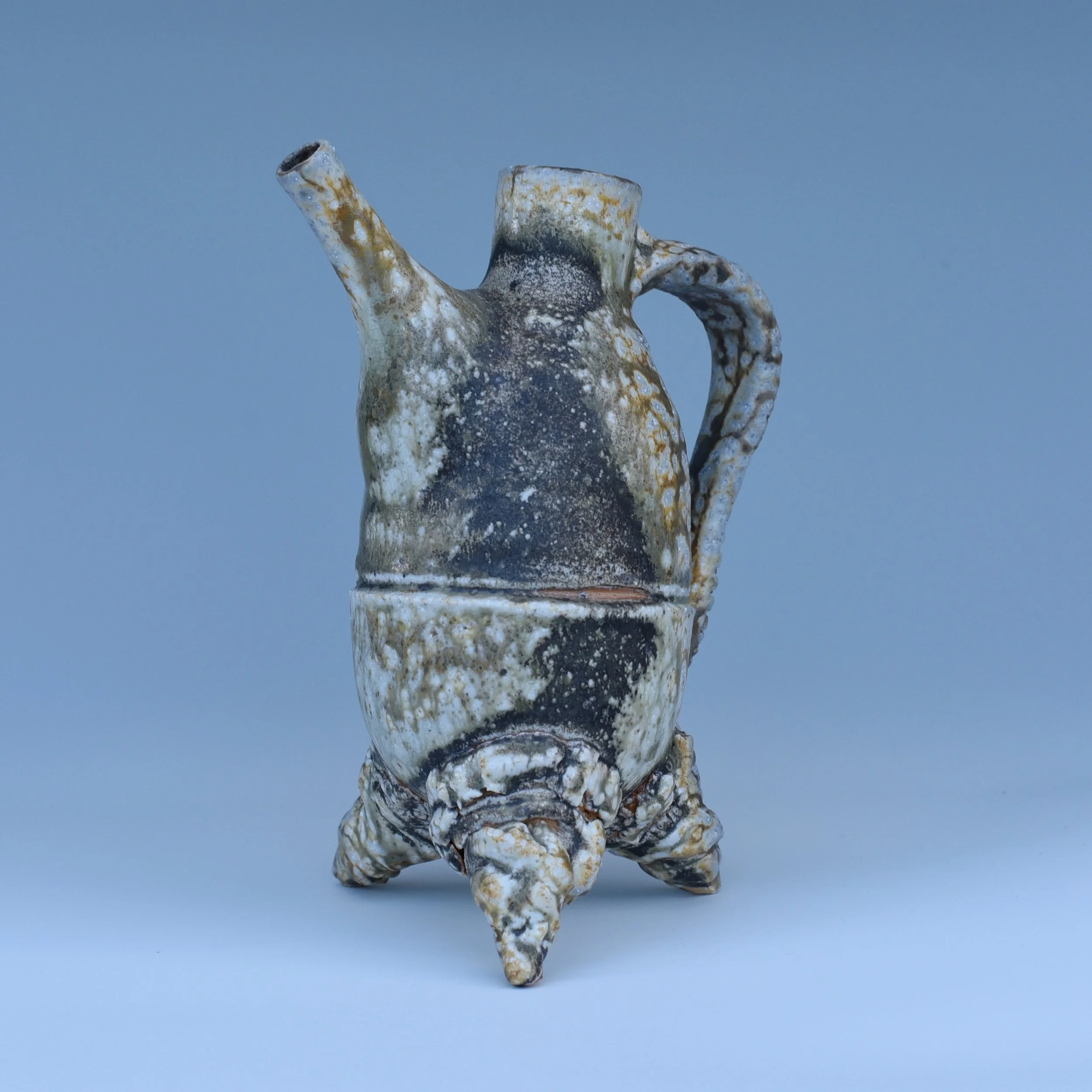 Two views of this pourer, recently fired in the train kiln @cobbartandecology 

I like forms that sit somewhere between a pot and a living thing. This one feels a bit like a seed pod, a shell, or some strange little creature. Every time I look at it,