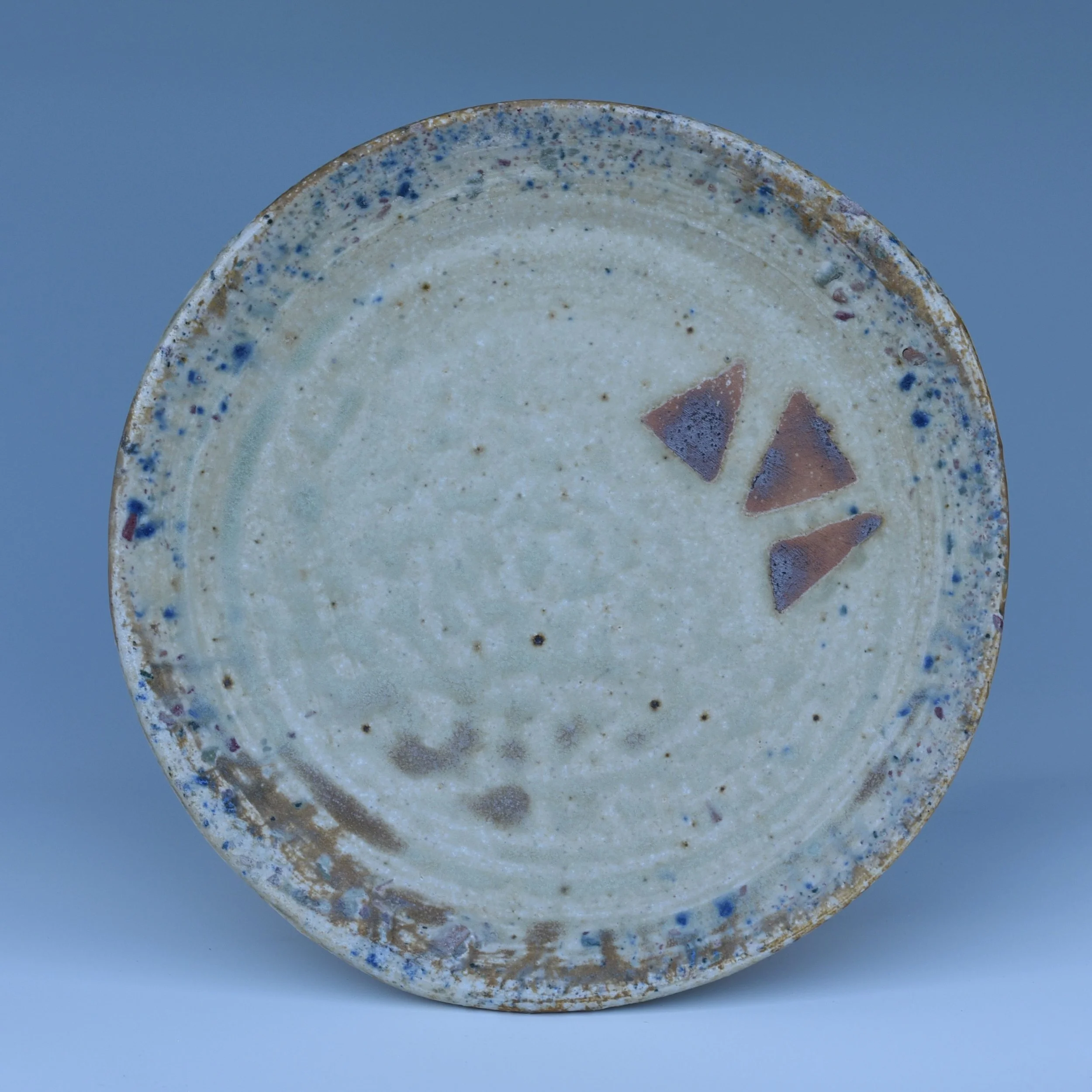 I&rsquo;ve been making plates lately. A deceptively difficult form that I&rsquo;ve resisted for a long time.

This one reminds me why they&rsquo;re worth the effort. Soft ash deposits, scattered cobalt flashes, and three red clay wadding marks that b