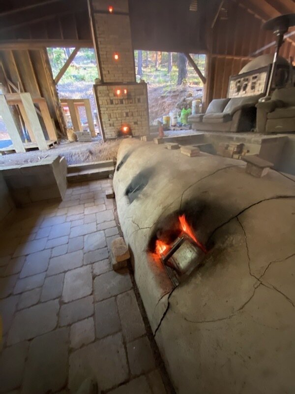 An anagama kiln right after a big stoke of wood