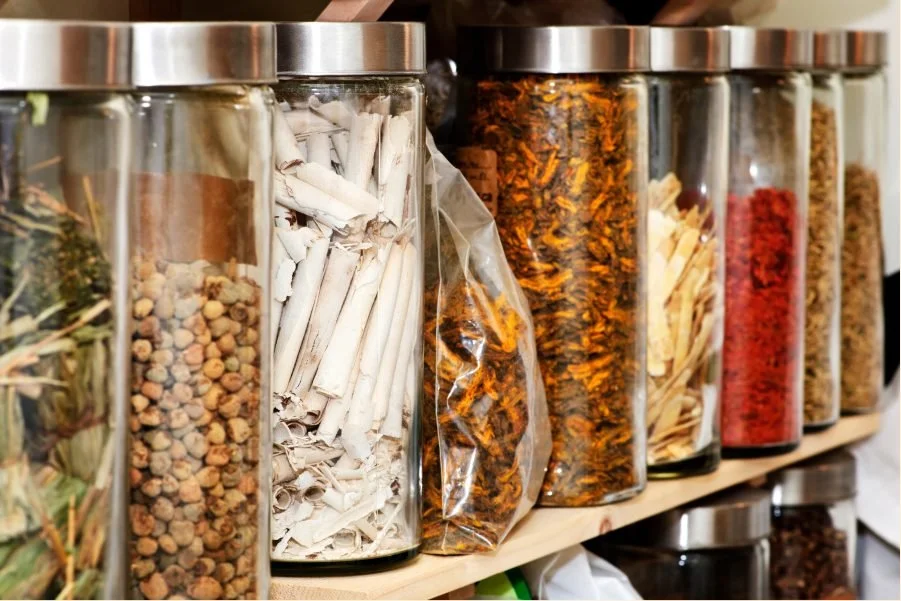 Glass jars of dried herbs used in Korean herbal medicine at YSC Acupuncture in Midwood, Brooklyn