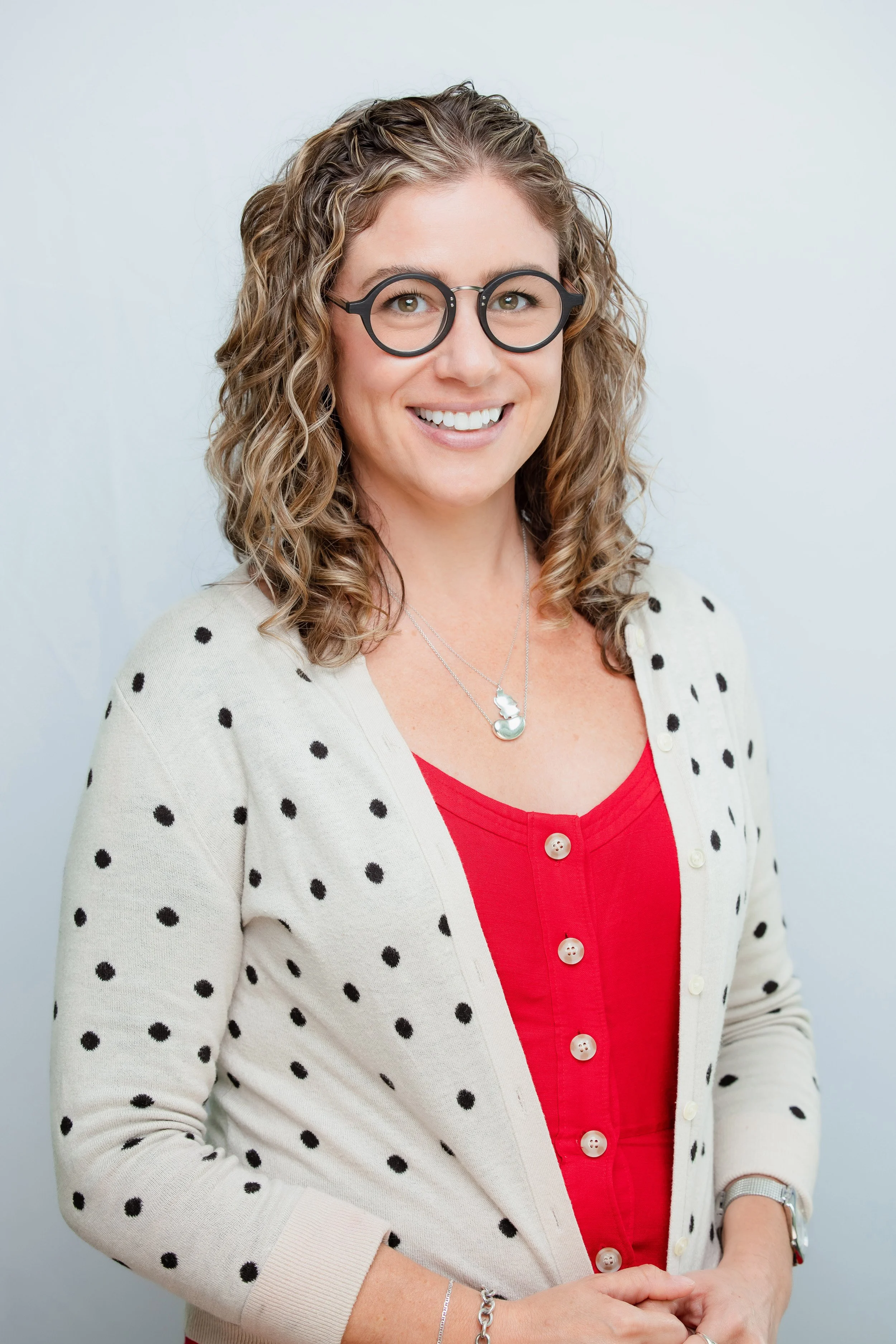 business headshot of a woman smiling looking at the camera