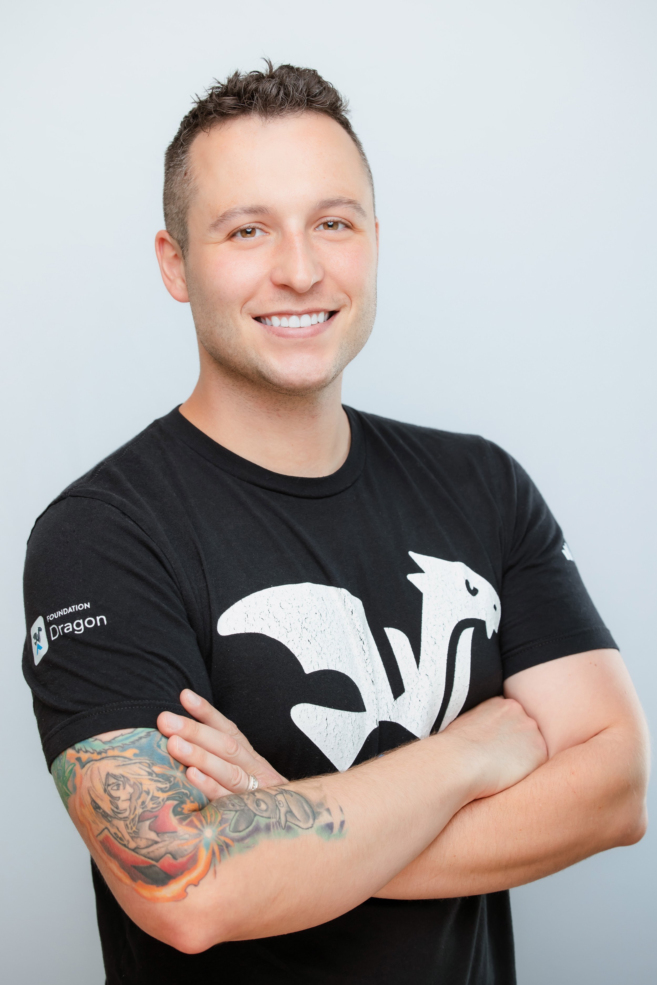 business headshot of a man smiling looking at the camera