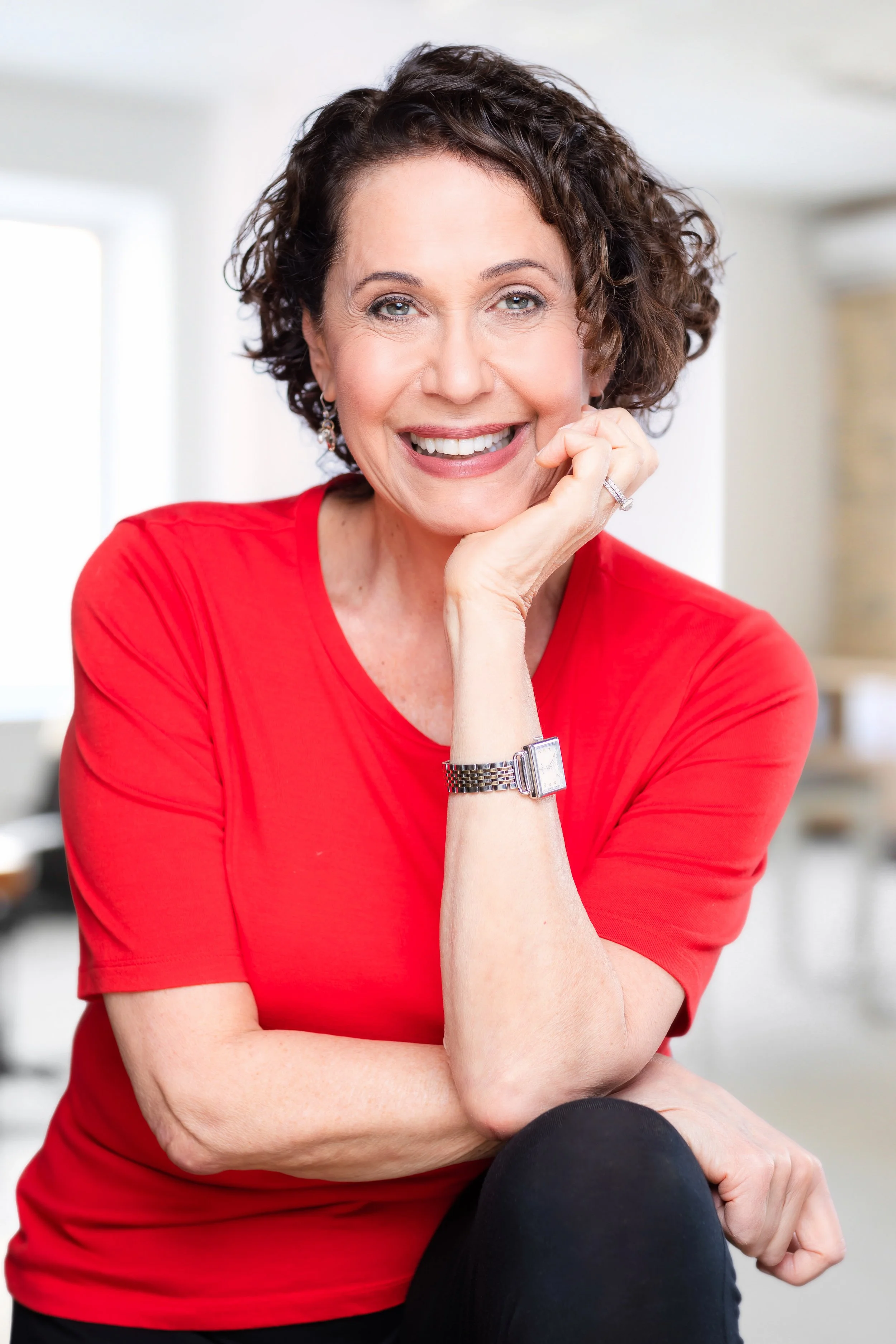 business headshot of a woman smiling looking at the camera