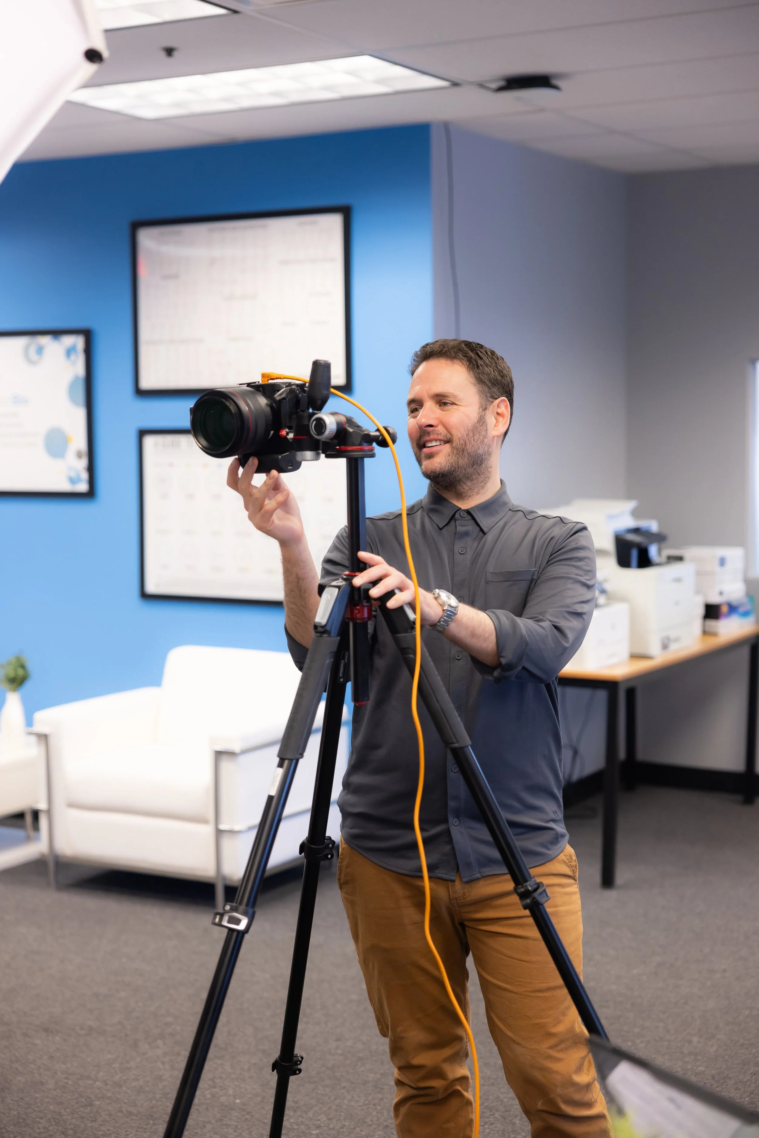 photographer taking photos with a camera on a tripod