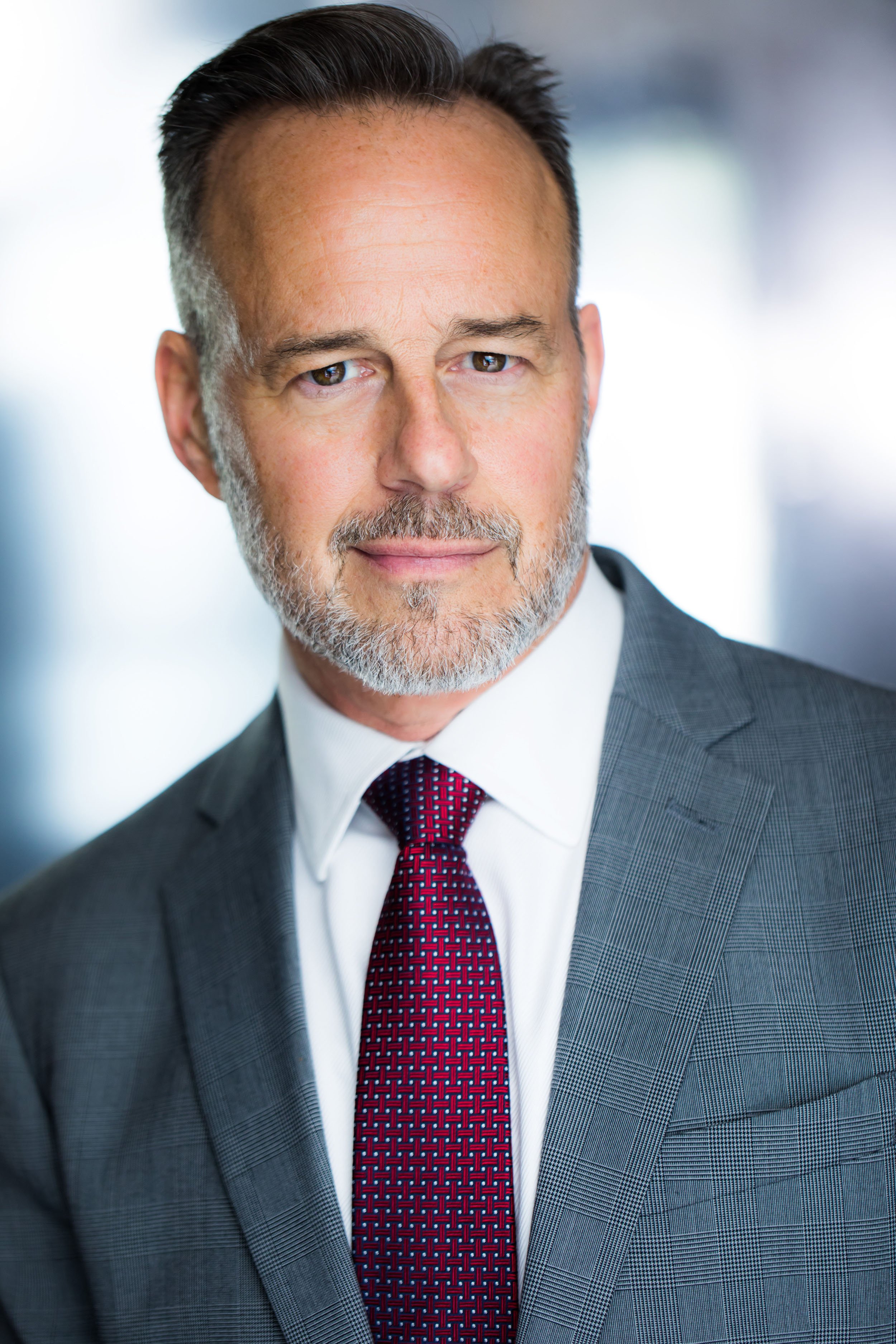 Professional corporate headshot setup with studio lighting and backdrop