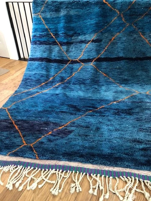 Beni mririt moroccan rug with shades of blue and orange accents 7x9