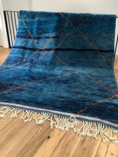 Beni mririt moroccan rug with shades of blue and orange accents 7x9