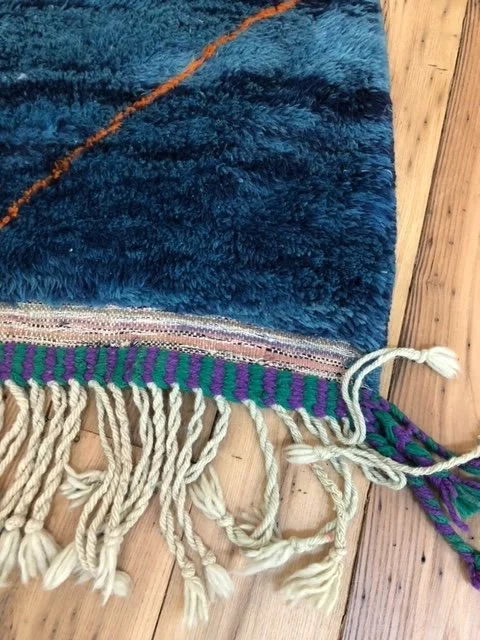 Beni mririt moroccan rug with shades of blue and orange accents 7x9