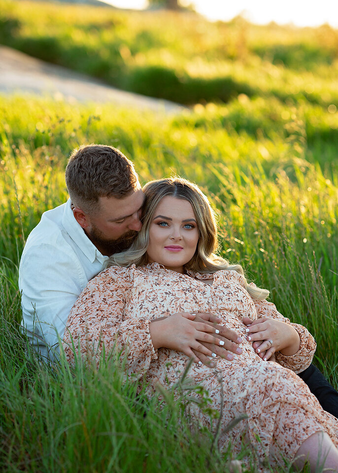 sitting in grass maternity session