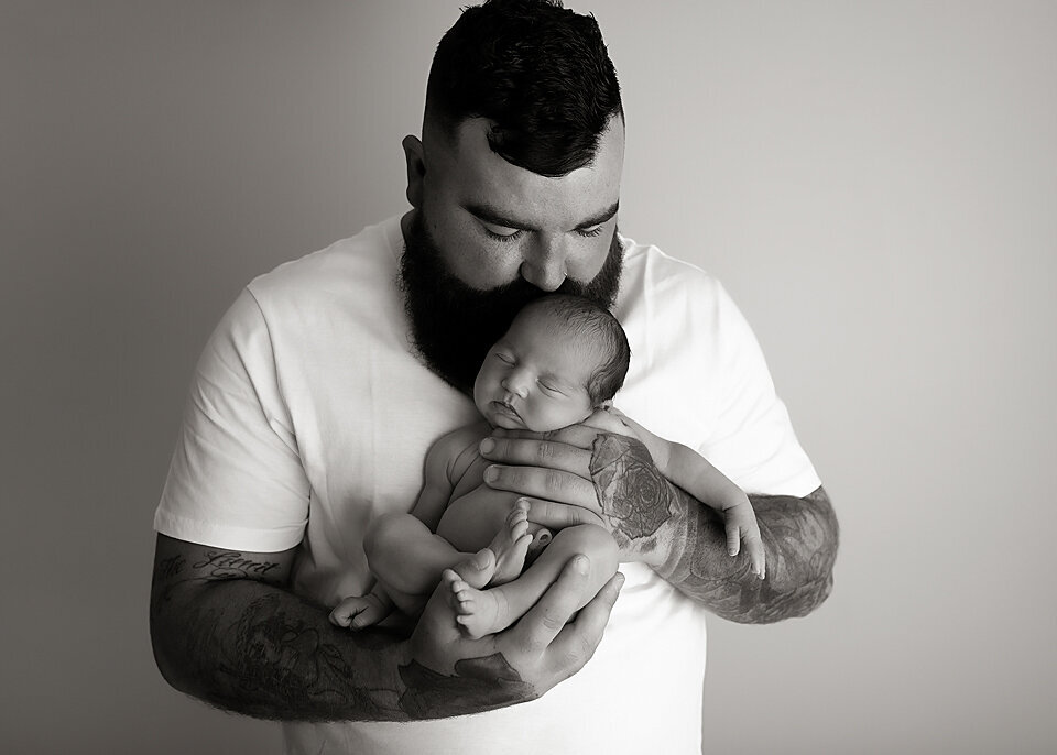 black and white photo newborn with dad Geelong