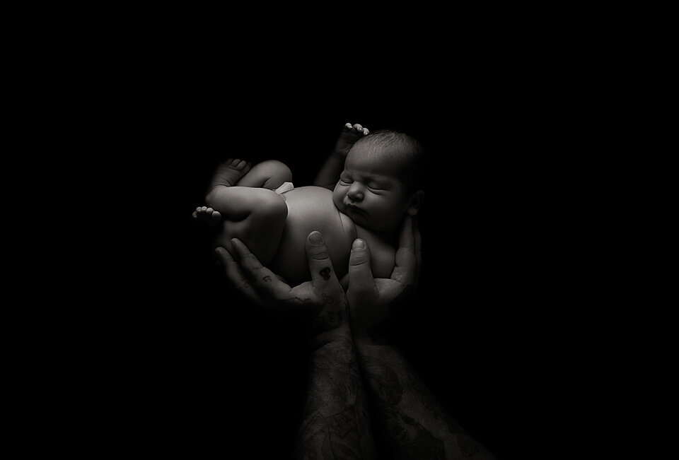 black and white newborn photo Geelong in dads hands