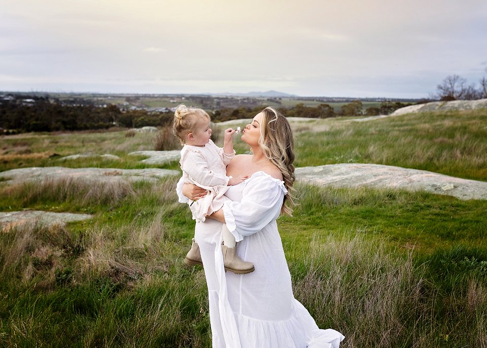 mother and daughter maternity photo white dress