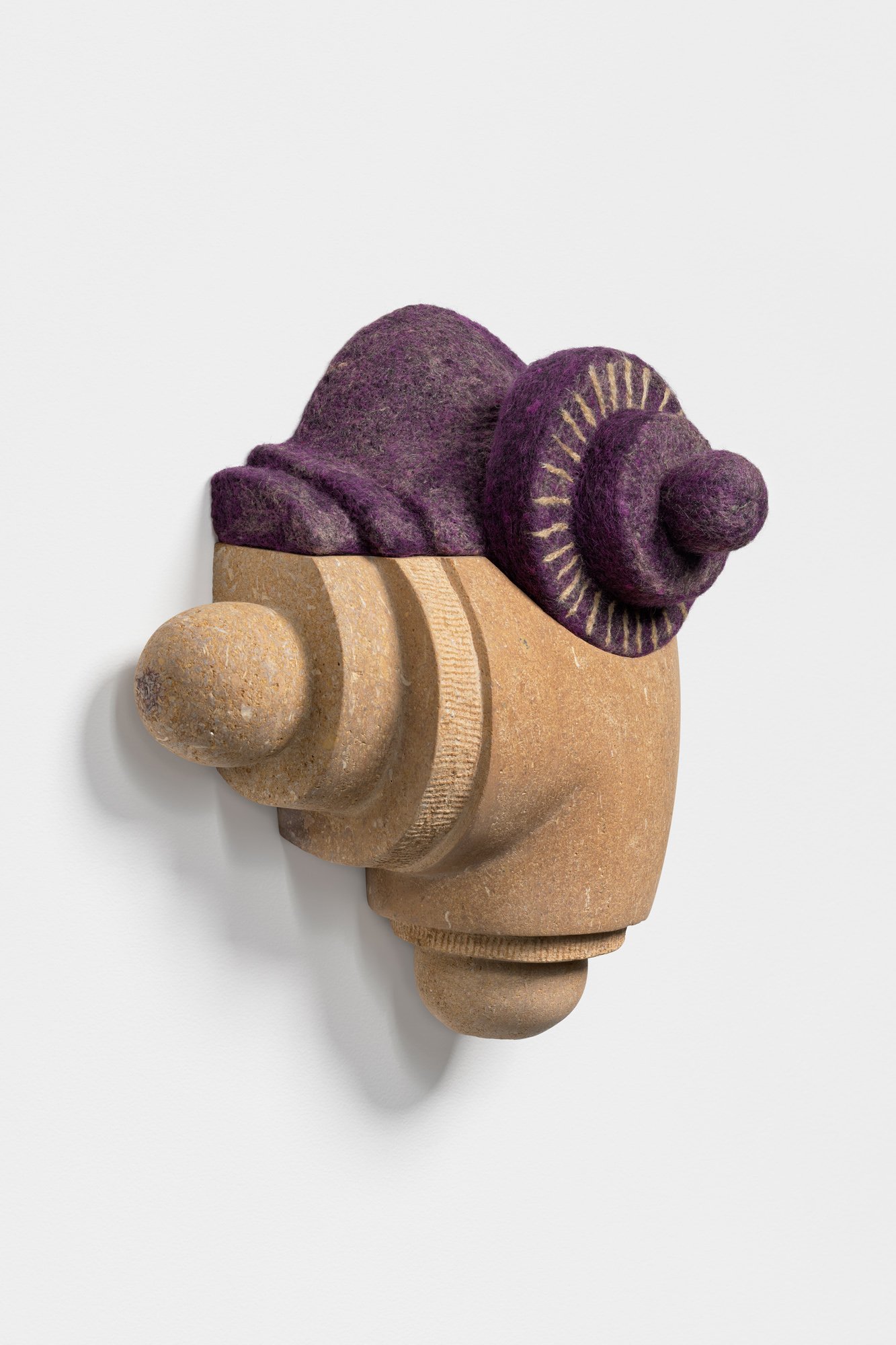 Conjure, 2022, limestone, wool and silk, 11 x 10 x 6 inches