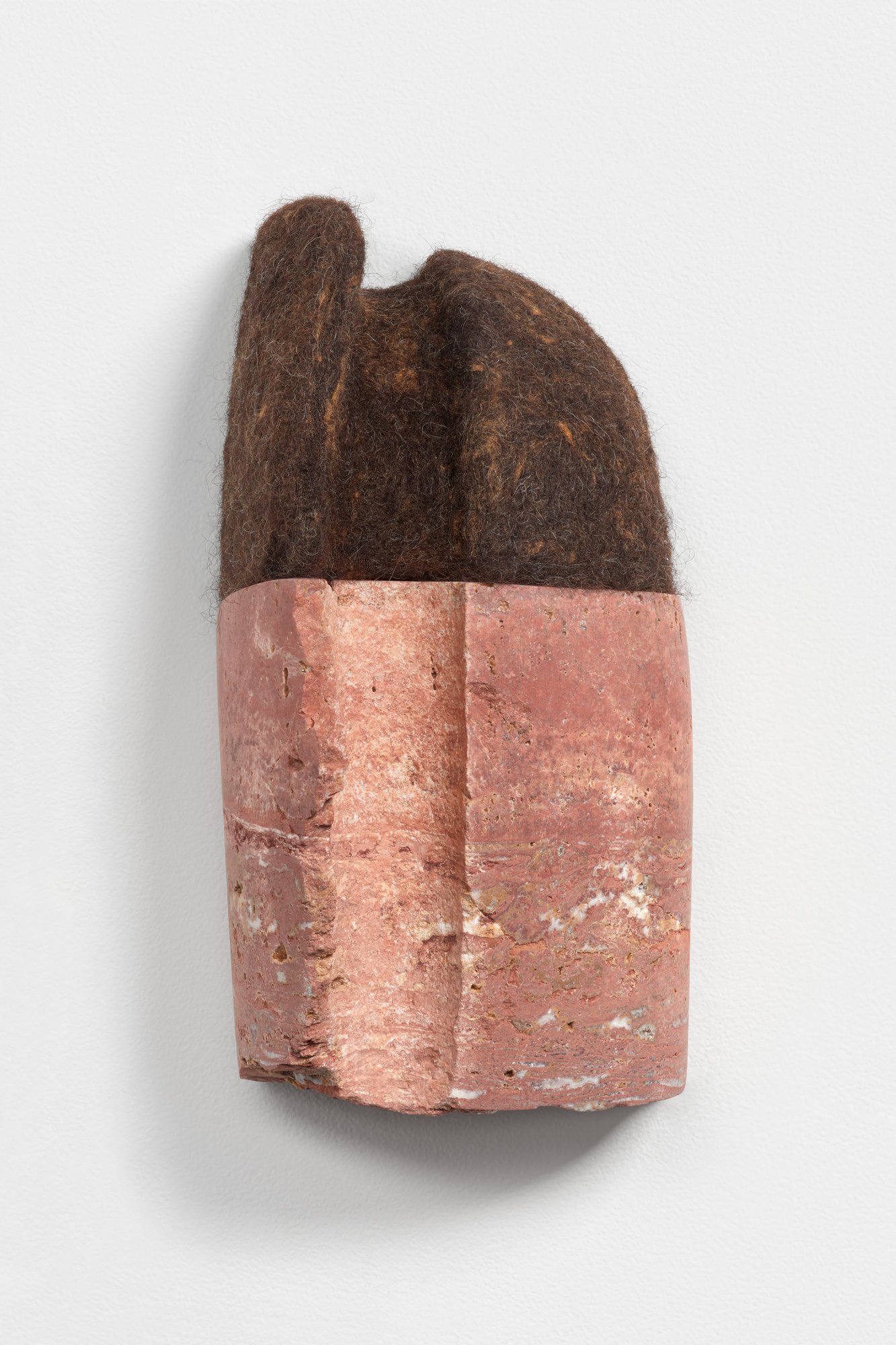 Curl, 2021, Persian travertine, wool and silk, 9 x 5 x 5 inches