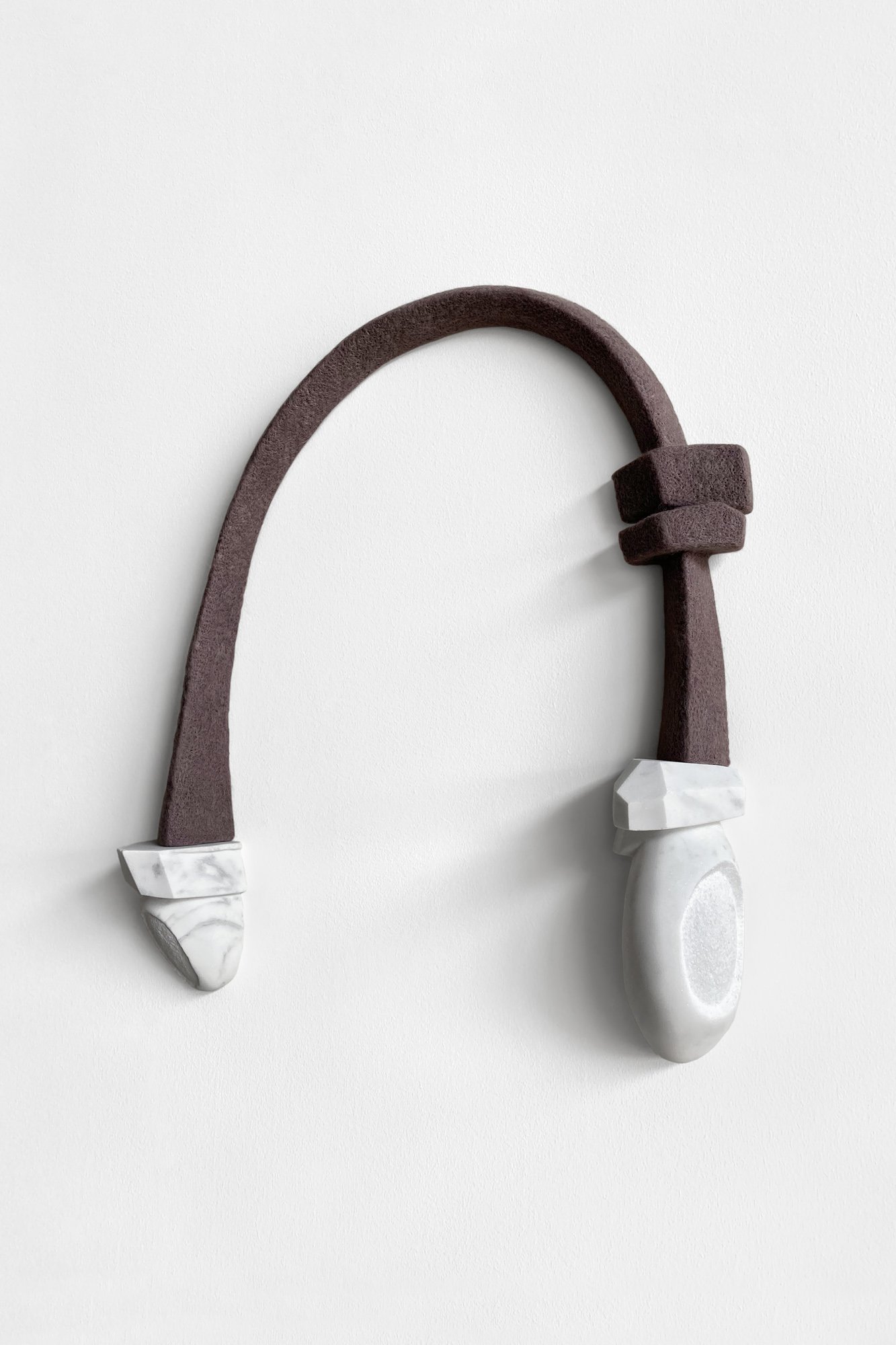 Arch, 2021, reclaimed marble and wool, 28 x 24 x 5 inches