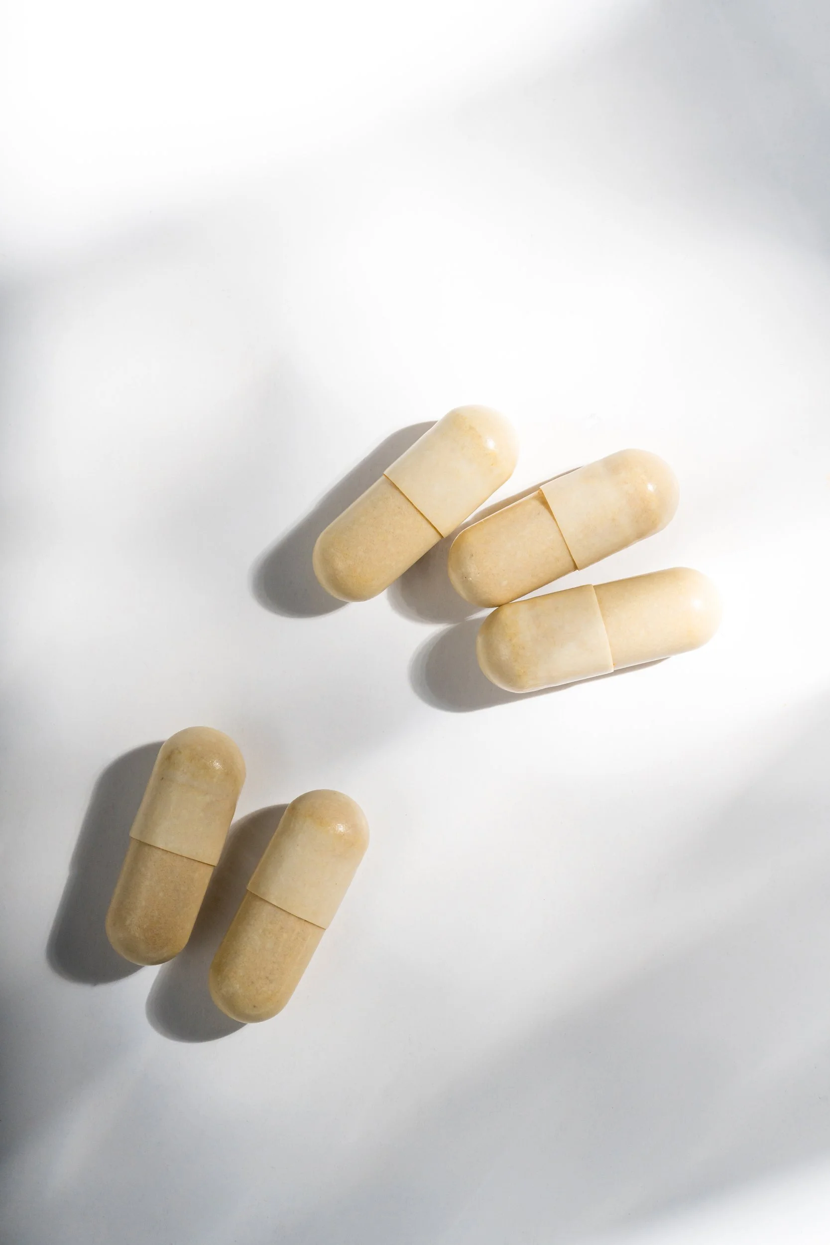 Capsules under diffracted light product photo