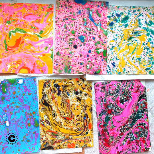 Colourful marbling artworks created during a student art workshop