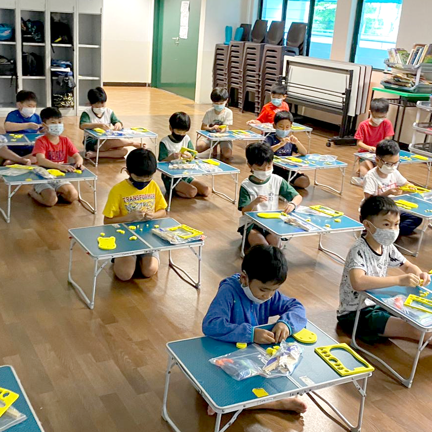 Students taking part in hands-on school workshops by Little Changemakers in Singapore