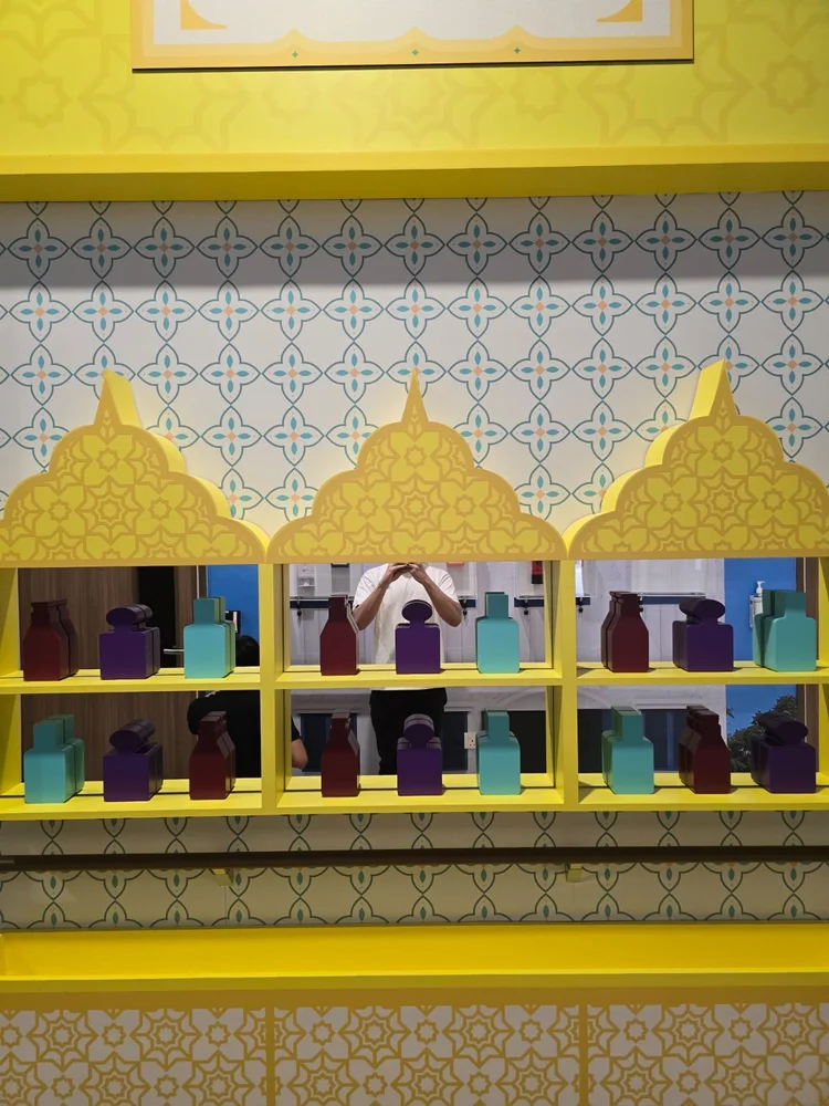 An interactive perfume shop inspired by Arab Street, with colourful aromatic bottles