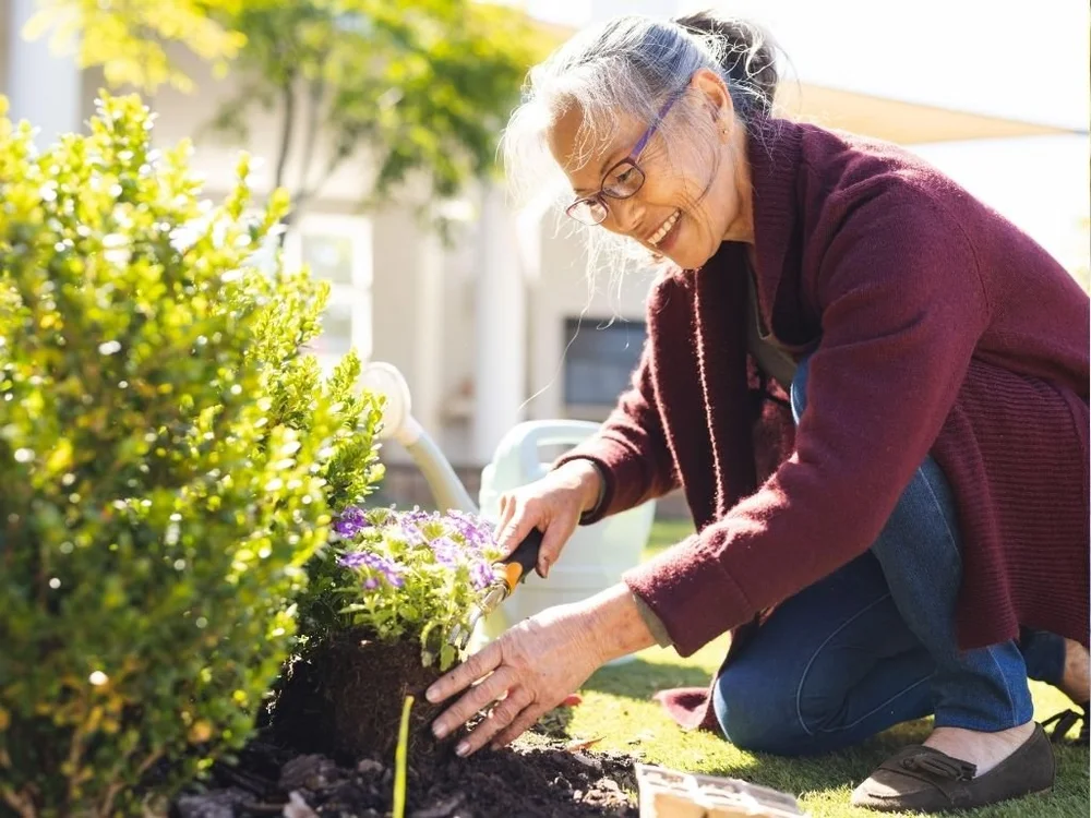 Senior doing gardening in Open Village nursing home Singapore