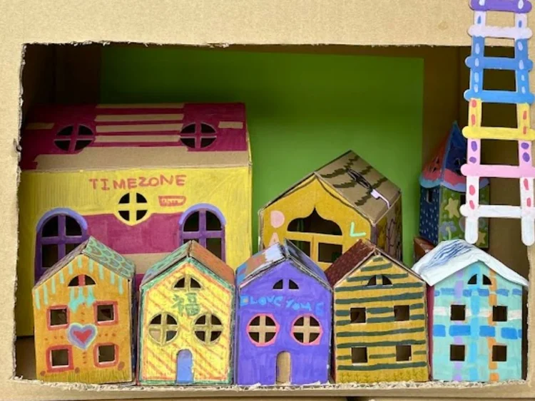 Collaborative process art project created by students using colourful mixed materials