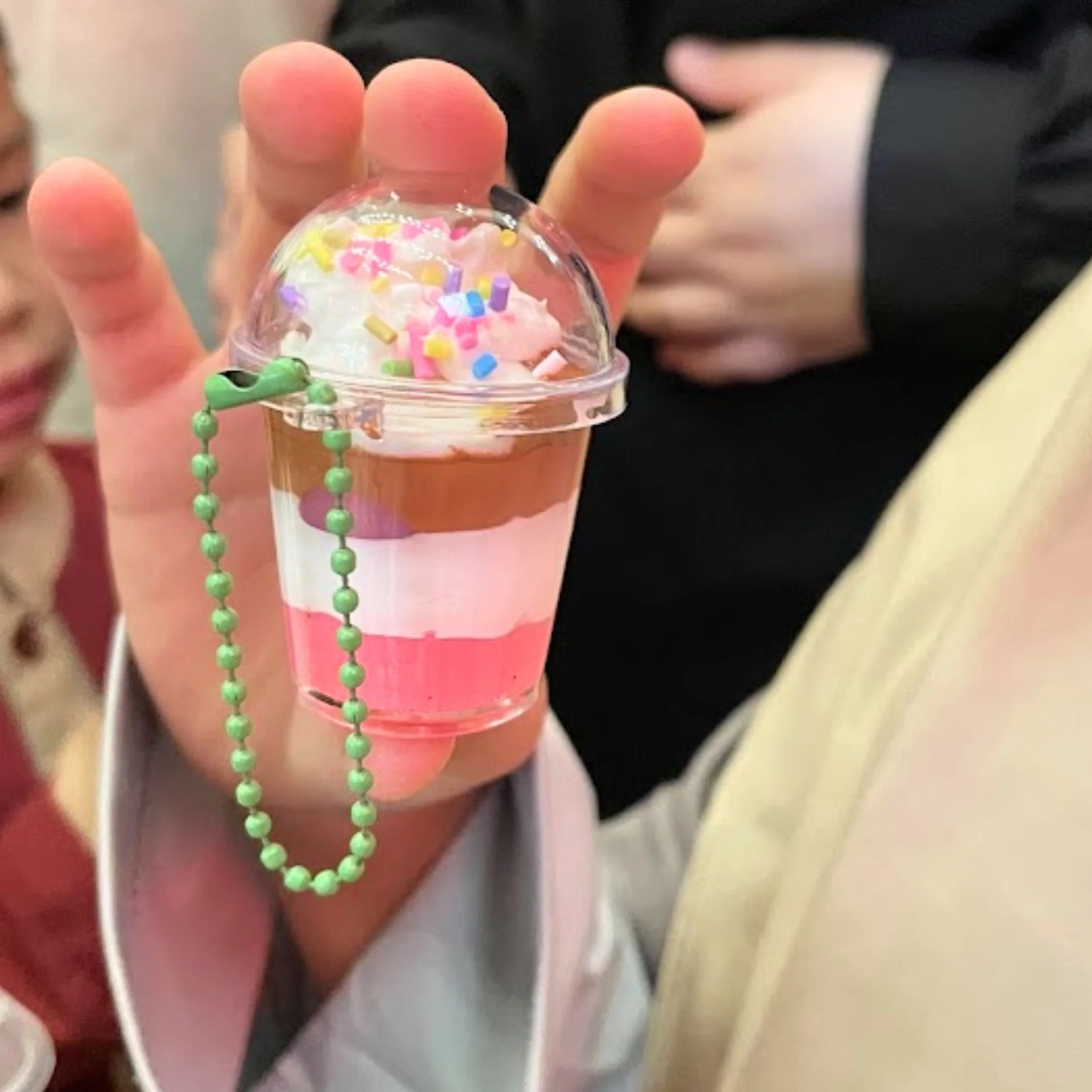 Participants making mini sundaes at a community centre activity in Singapore.