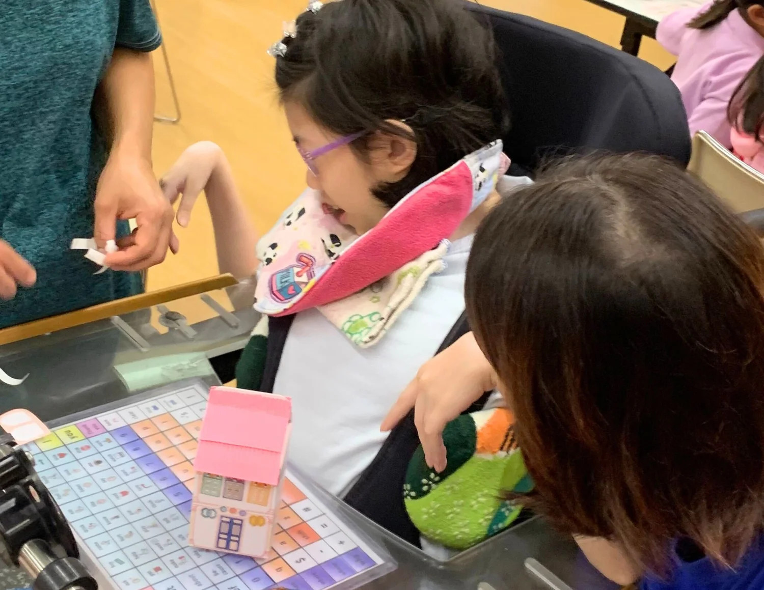 Inclusive participant making a heritage shophouse model at a public festival in Singapore