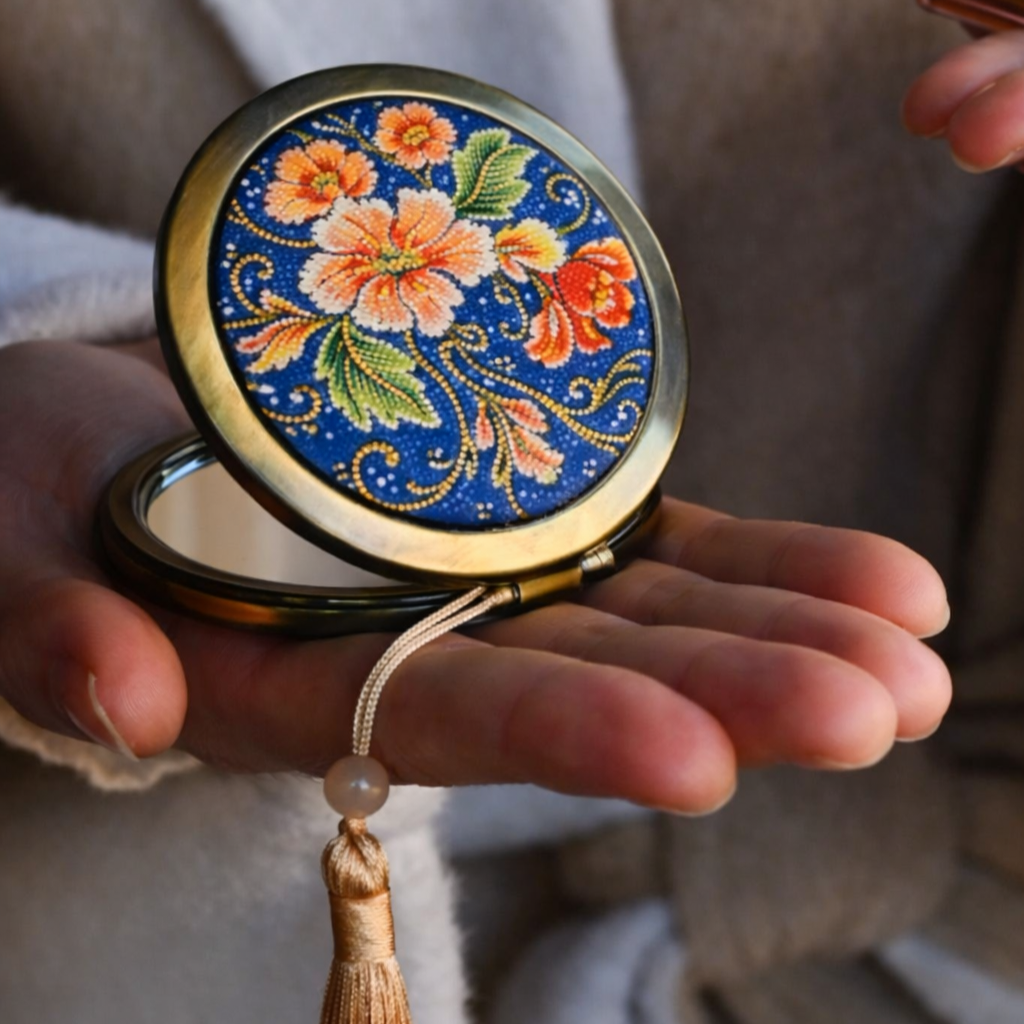 Children’s handmade batik-decorated pocket mirror created as a Mother’s Day gift