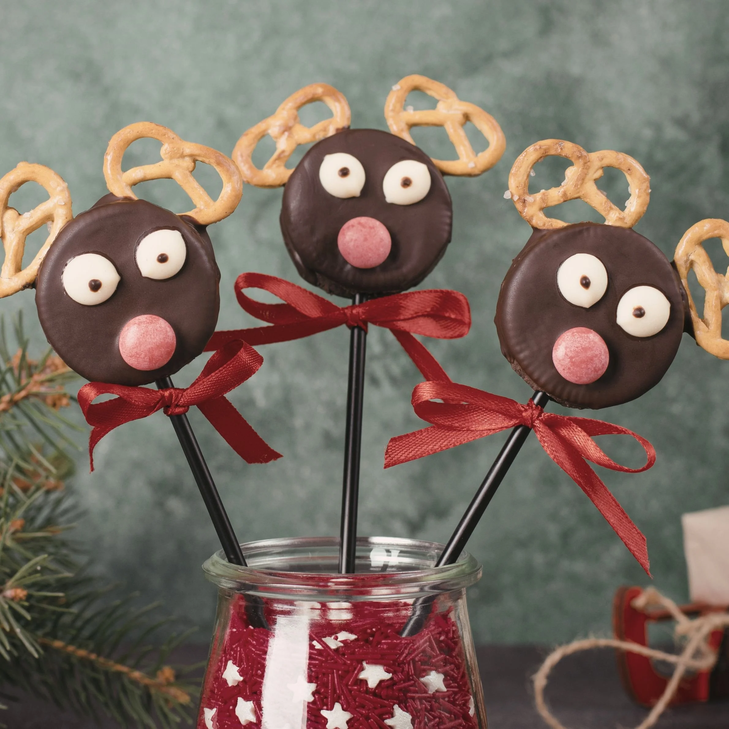 Participants making DIY chocolate pops at a Christmas festival activity in Singapore.