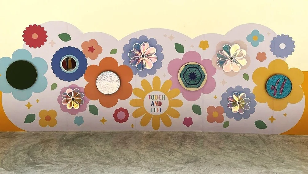 Thematic multisensory wall design for inclusive play space