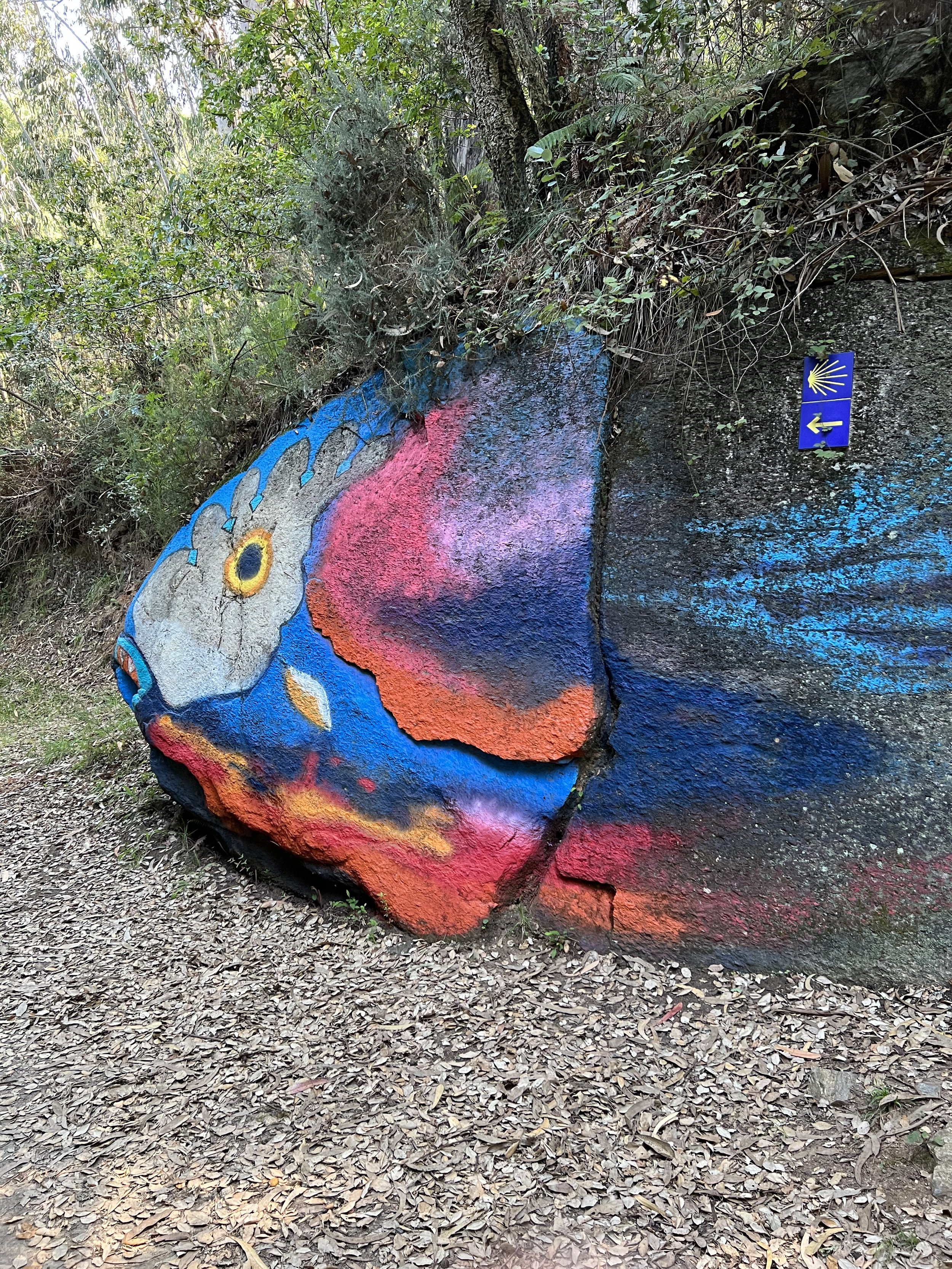 Fish painted rock with El Camino trail marker