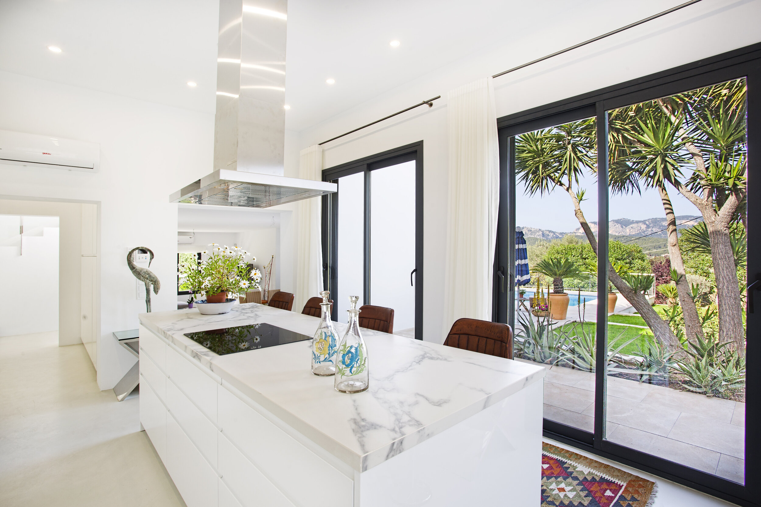 Bespoke design called 'blanco estatuario' made in porcelanico top, ideal for cooking as well as hosting.