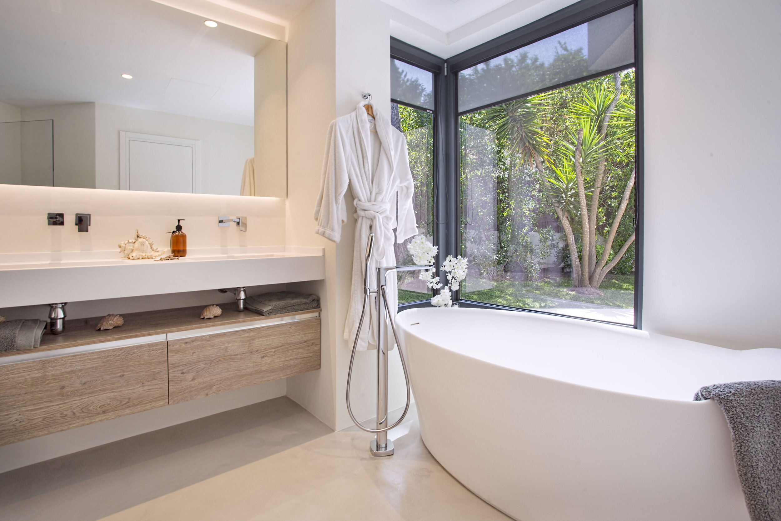 Designer bath overlooking the tropical garden.