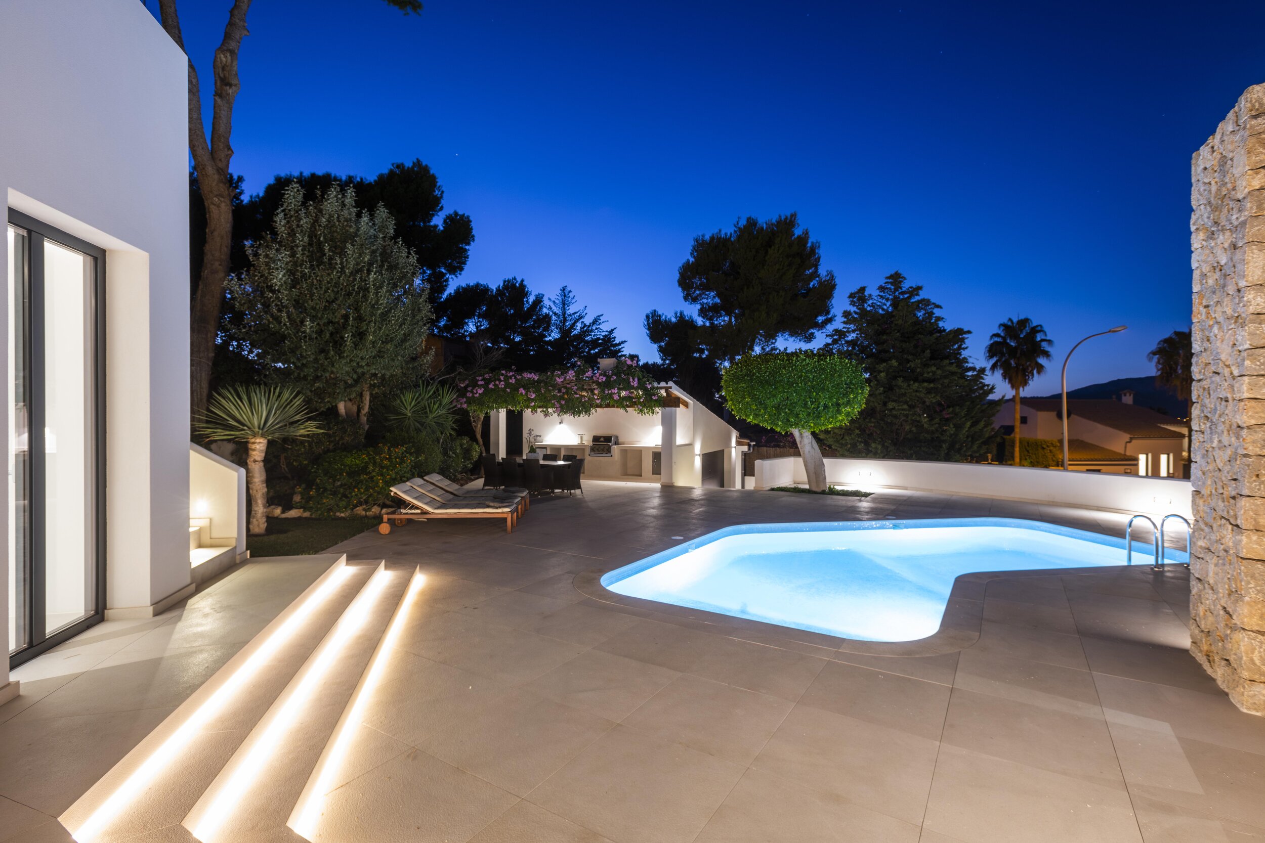 Soft LED lighting encompasses the pool at night.