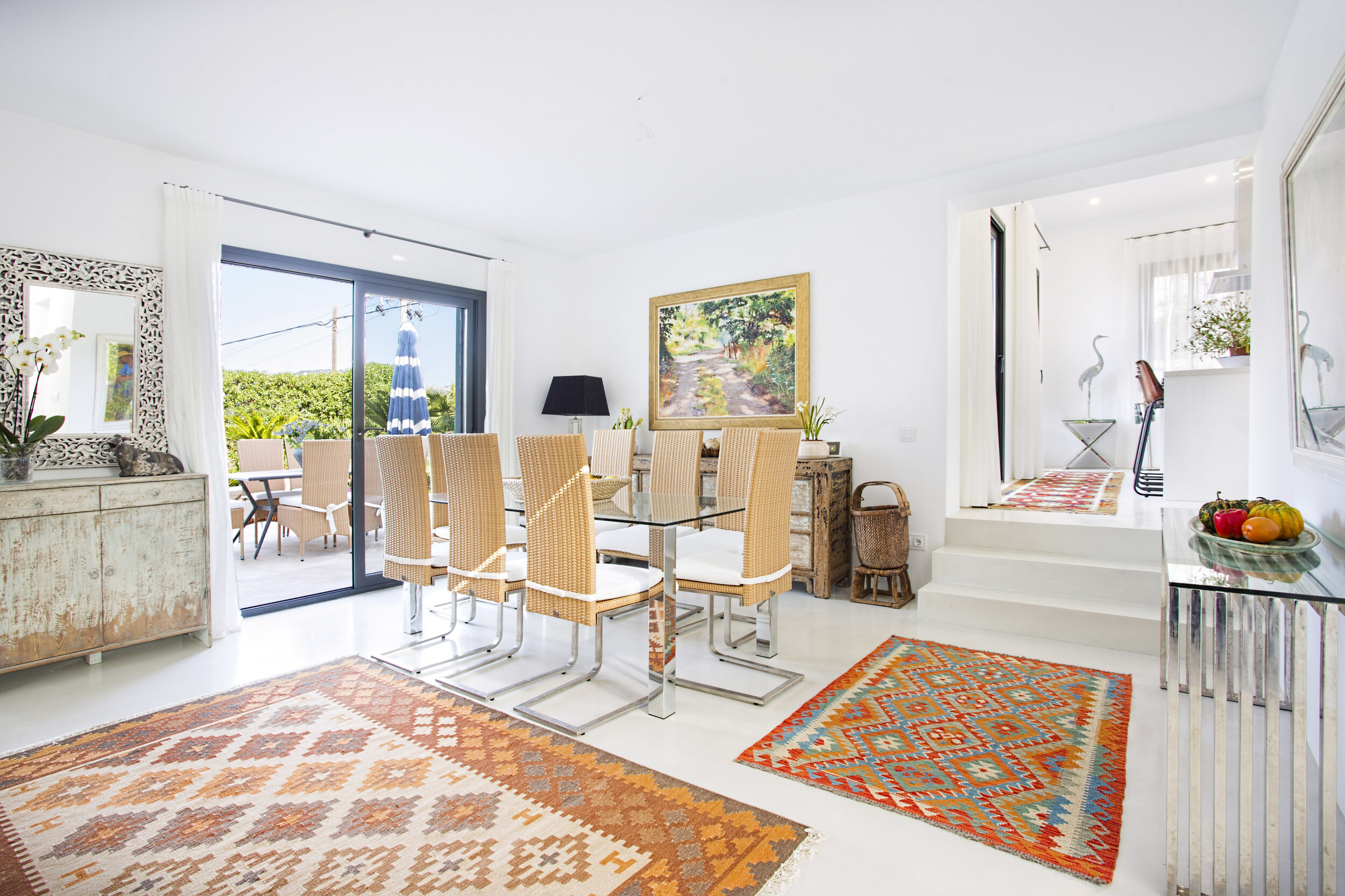 Details of the Kilim carpets, and beautiful dining furniture.