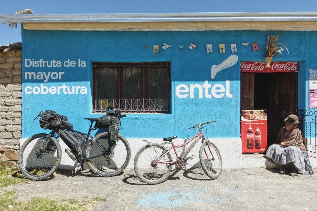 Scenes from bikepacking through Bolivia&rsquo;s 🇧🇴 altiplano: 

1: making bicycle friends at little tiendas (shops) with traditional bowler-hat attendants 

2: altiplano gaucho on bicycle instead of horseback

3: herding sheep in the highlands at a