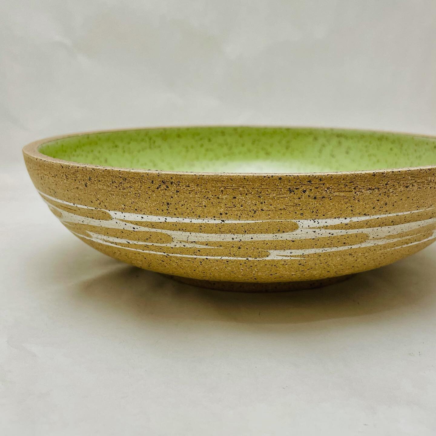 A large serving bowl with lime glaze.