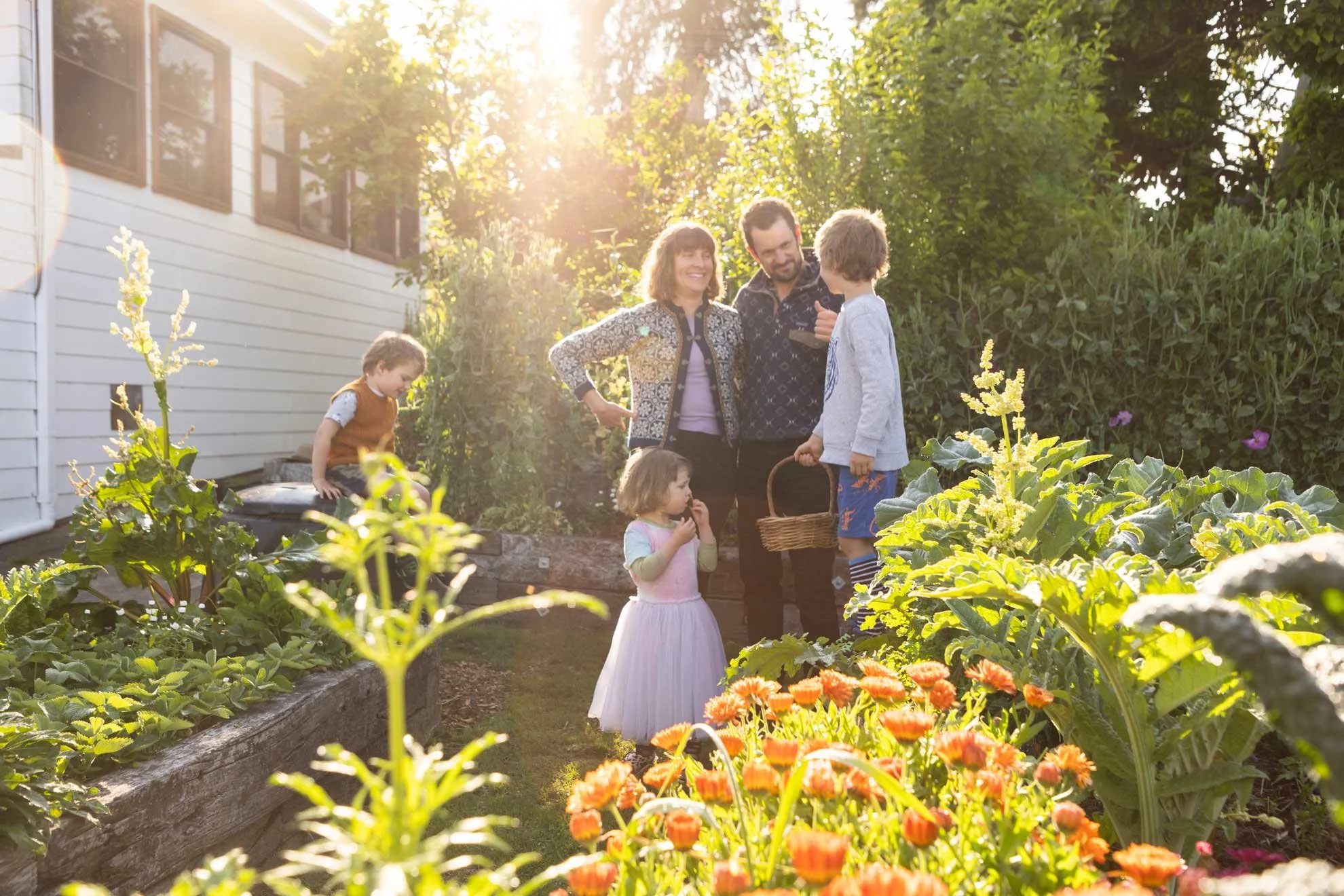 Photo of Compostable Kate and her family in the veggie garden for 'The Compost Coach Book' photographed by Honey Atkinson