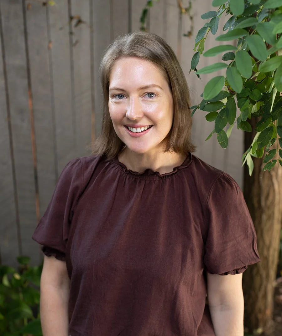 Career alignment practitioner Samantha standing outside feeling connected to nature