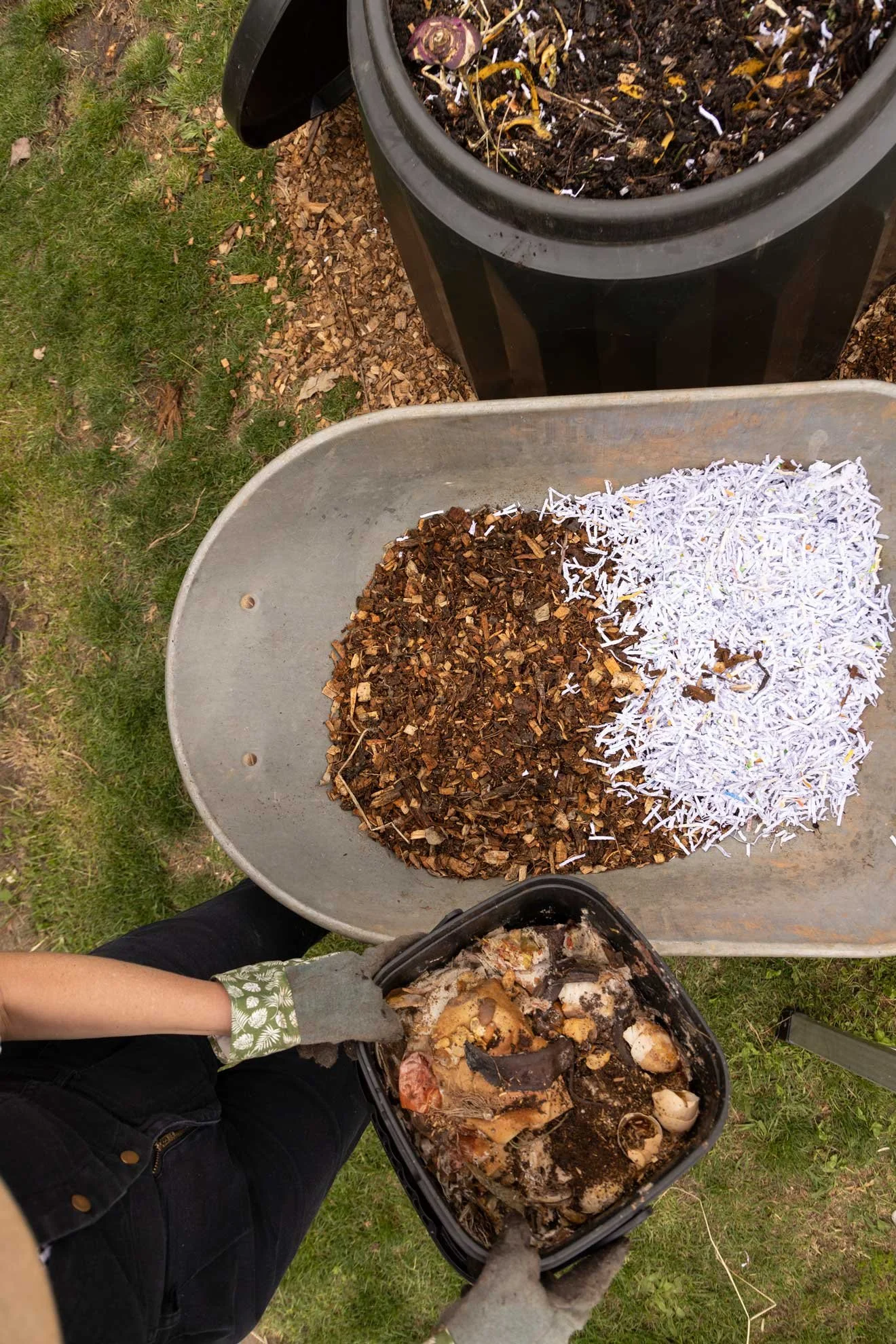 Photo of Composable Kate setting up compost bin from 'The Compost Coach' book photographed by Honey Atkinson