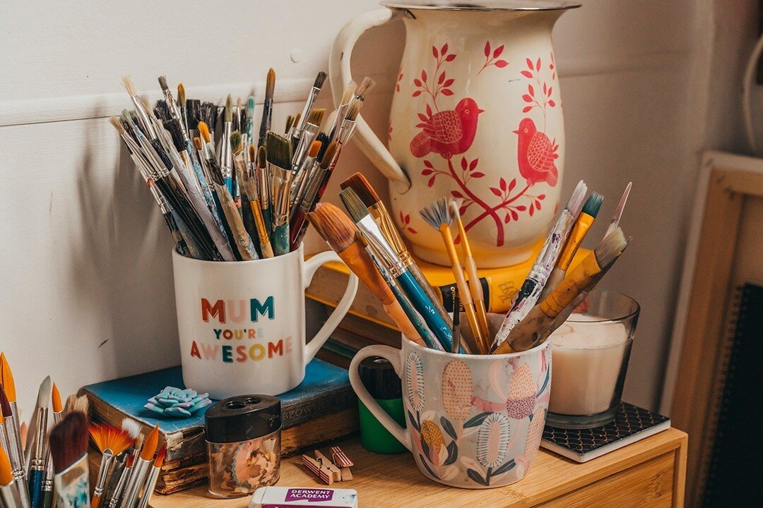 Favourite brushes in favourite mugs.  I like simple storage.  The jug at the back is vintage from the op shop.  I have candles I don't burn and can't smell over the paint.... but their presence make me feel relaxed.⁠
⁠
I tried separating brushes but 