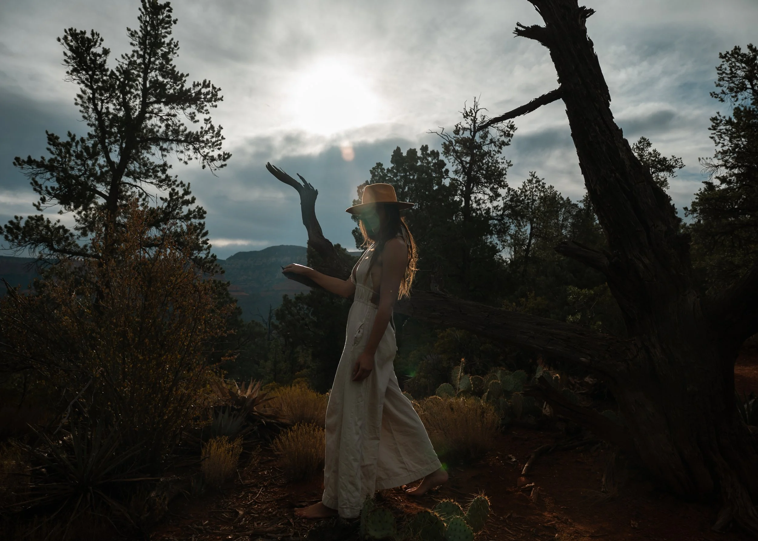 Silhouette of woman wearing a yellow hat