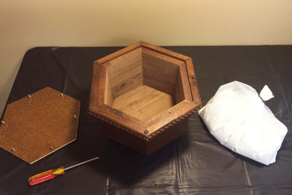Filling a large urn isn’t too hard, especially if you keep the cremated remains in their plastic bag.