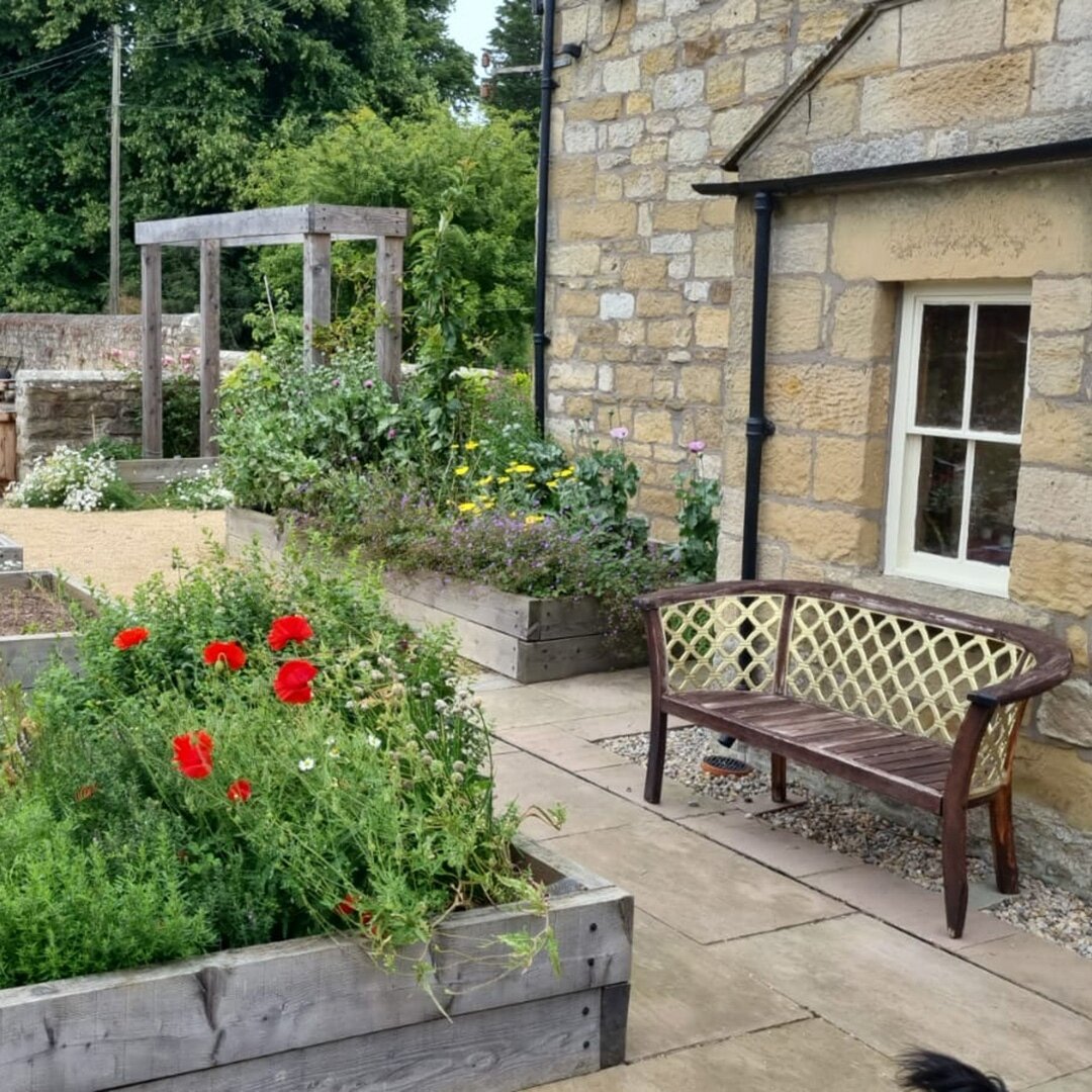 Northumberland Kitchen Garden weathering well by the looks of these client photos.  Each year will bring a different combination of colours and textures as the planting matures and the crops are rotated.⁠
⁠
The raised timber beds have turned to a sof