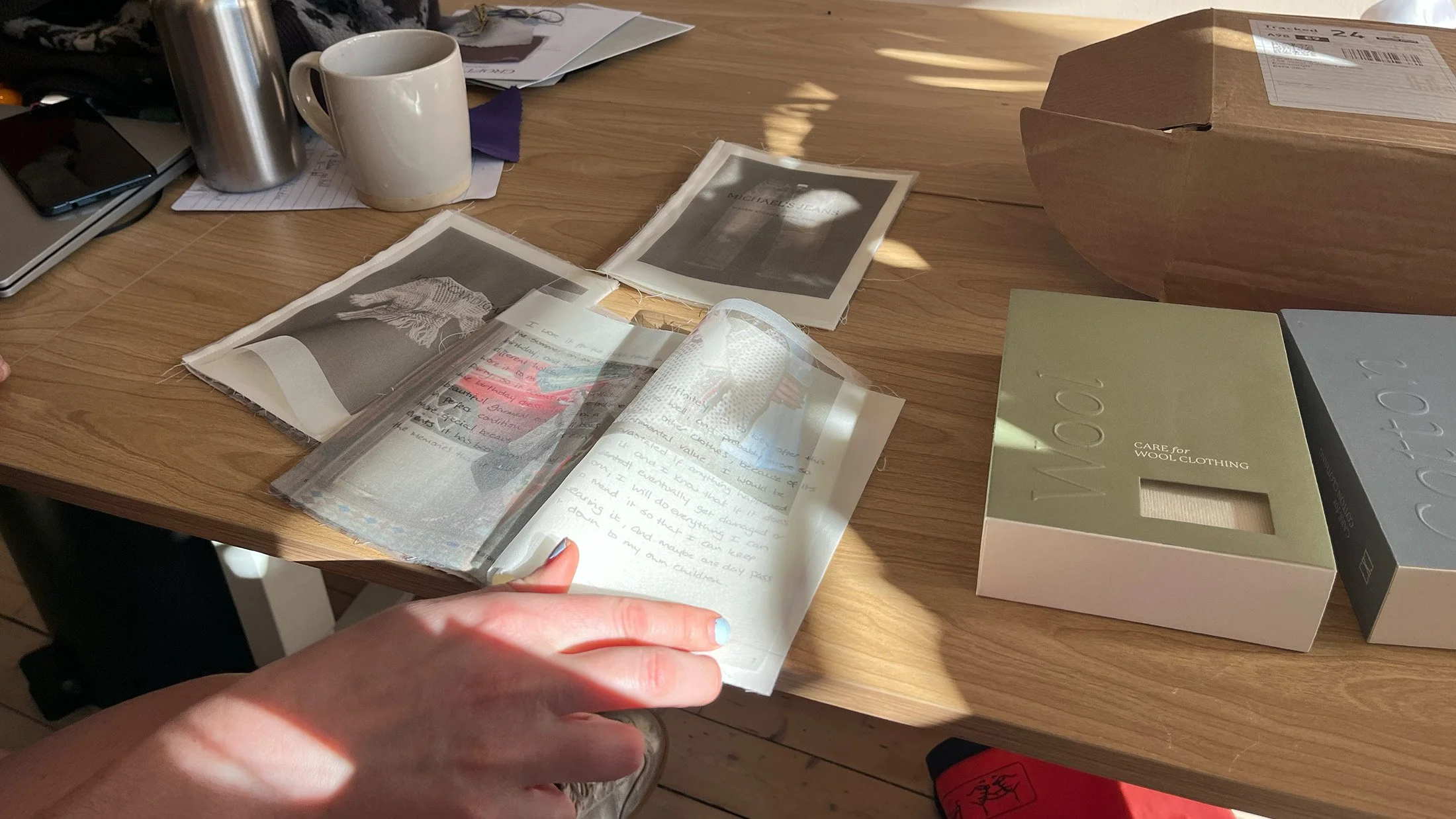 The owner of Paradigm Shift looking through a Woven Stories book.